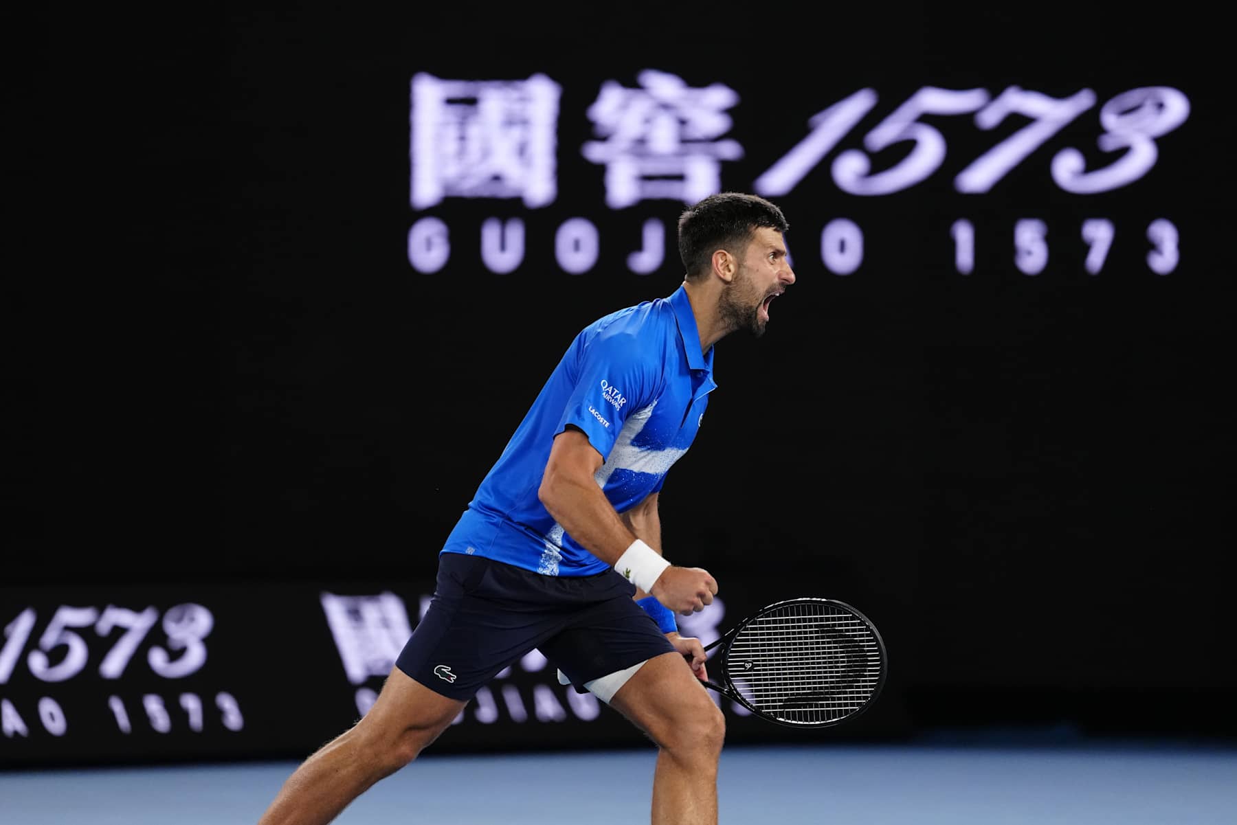 MELBOURNE, AUSTRALIA - JANUARY 21: Novak Djokovic of Serbia acknowledges the crowd after winning against Carlos Alcaraz of Spain in the Men's Singles Quarterfinal match during day 10 of the 2025 Australian Open at Melbourne Park on January 21, 2025 in Melbourne, Australia. (Photo by Fred Lee/Getty Images)