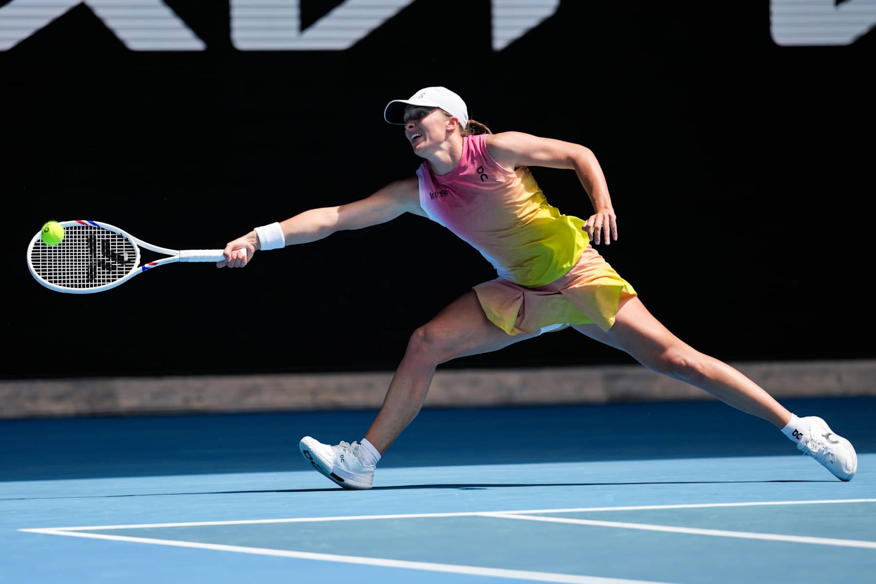 MELBOURNE, AUSTRALIA - JANUARY 22: Iga Swiatek of Poland plays a forehand in the Women's Singles Quarter Finals match against Emma Navarro of the United States during day eleven of the 2025 Australian Open at Melbourne Park on January 22, 2025 in Melbourne, Australia. (Photo by Shi Tang/Getty Images)