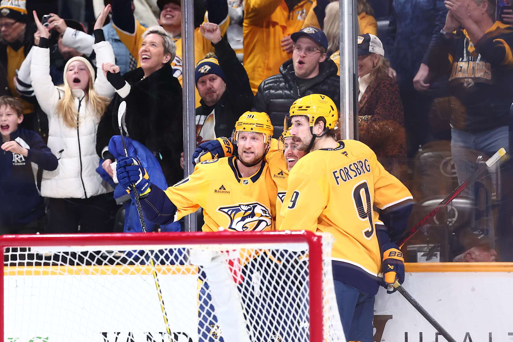 NASHVILLE, TENNESSEE - JANUARY 21: Filip Forsberg #9 of the Nashville Predators and Steven Stamkos #91 celebrate a goal by Jonathan Marchessault #81 in the second period agains the San Jose Sharks on January 21, 2025 at Bridgestone Arena in Nashville. (Photo by Casey Gower/NHLI via Getty Images)