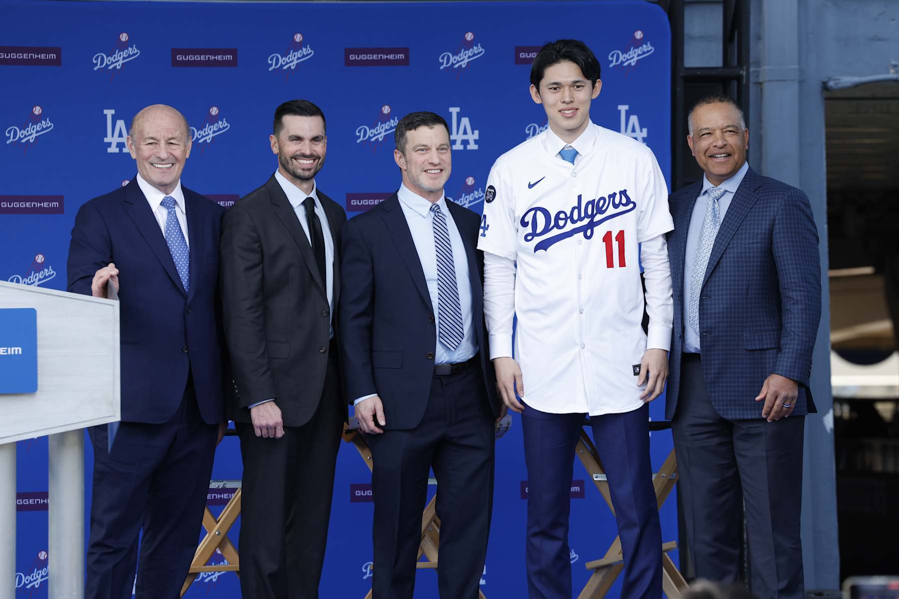 LOS ANGELES, CALIFORNIA - JANUARY 22: (L-R) President and CEO Stan Kasten, Executive Vice President and General Manager Brandon Gomes, President Baseball Operations Andrew Friedman,  Pitcher Roki Sasaki and Manager Dave Roberts speaks pose during a Los Angeles Dodgers press conference at Dodger Stadium on January 22, 2025 in Los Angeles, California. (Photo by Kevork Djansezian/Getty Images)