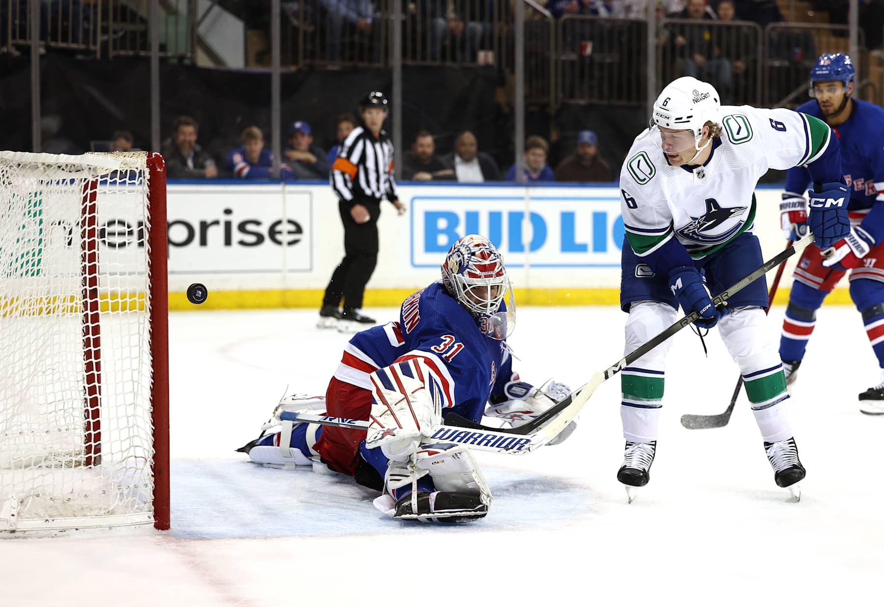 NEW YORK, NEW YORK - JANUARY 08: Brock Boeser #6 of the Vancouver Canucks gets the puck past Igor Shesterkin #31 of the New York Rangers to score a goal during the first period at Madison Square Garden on January 08, 2024 in New York City. (Photo by Elsa/Getty Images)