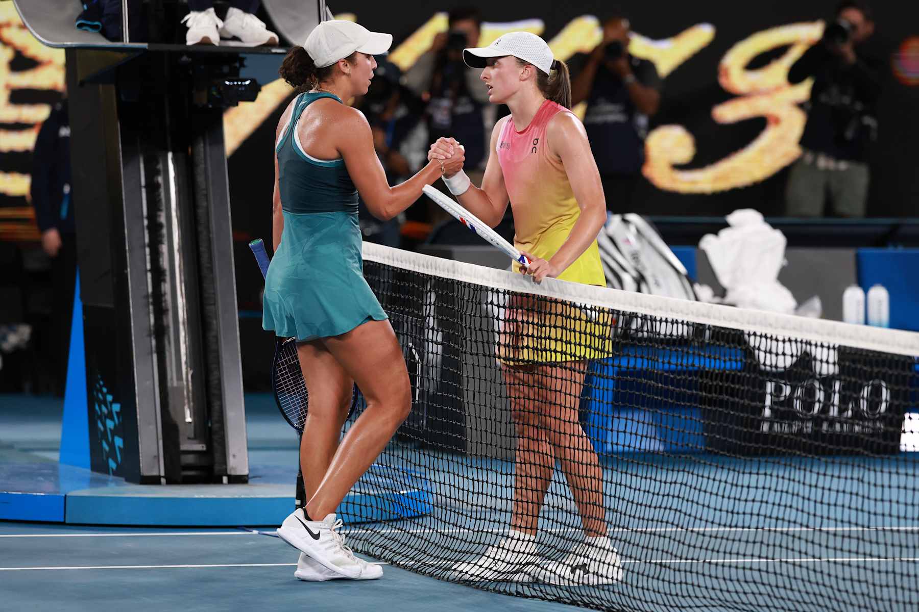MELBOURNE, AUSTRALIA - JANUARY 23: Madison Keys (L) of the United States shakes hands with Iga Swiatek (R) of Poland after winning the Women's Singles Semifinal during day 12 of the 2025 Australian Open at Melbourne Park on January 23, 2025 in Melbourne, Australia. (Photo by Darrian Traynor/Getty Images)