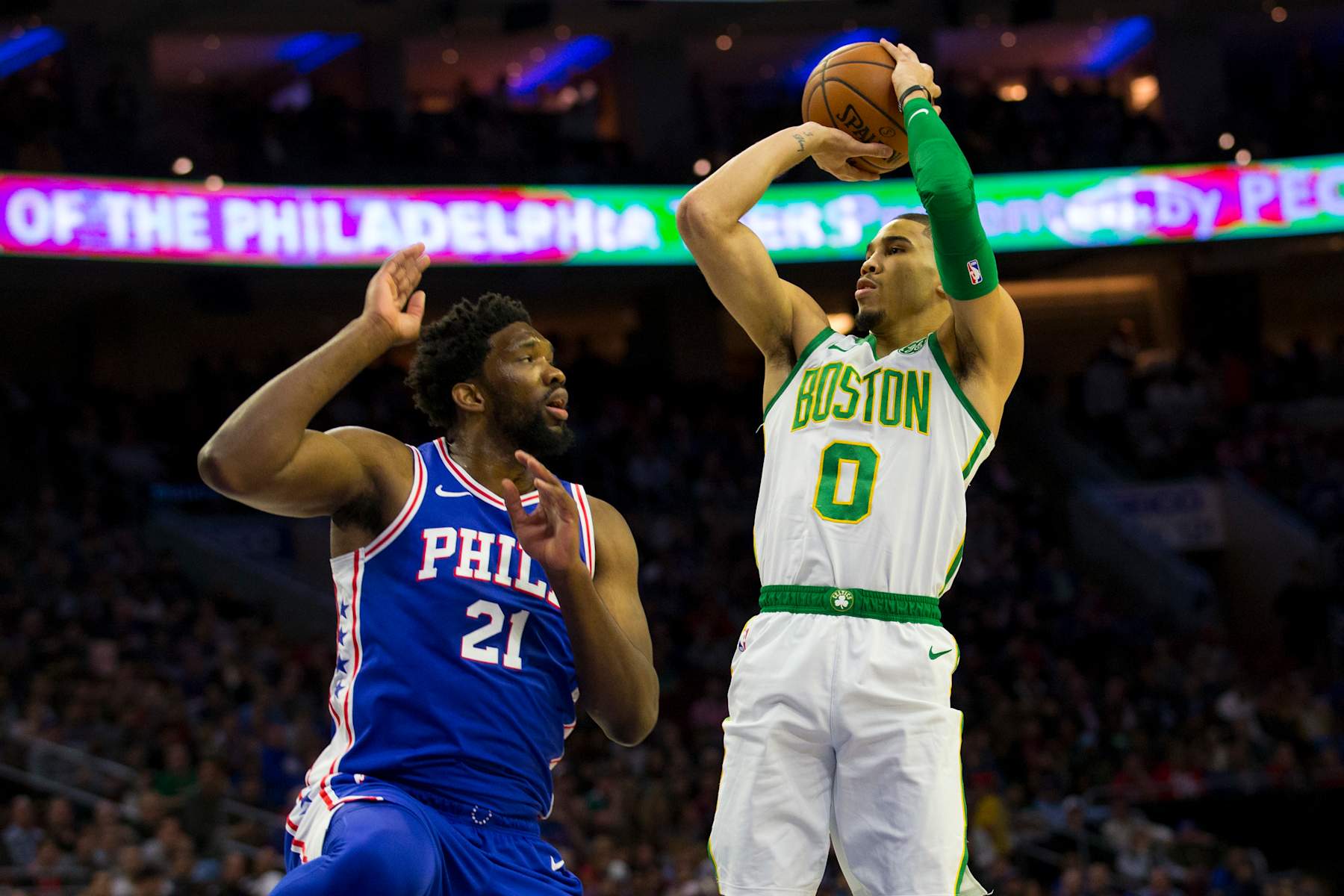 PHILADELPHIA, PA - MARCH 20: Jayson Tatum #0 of the Boston Celtics shoots the ball against Joel Embiid #21 of the Philadelphia 76ers in the first quarter at the Wells Fargo Center on March 20, 2019 in Philadelphia, Pennsylvania. NOTE TO USER: User expressly acknowledges and agrees that, by downloading and or using this photograph, User is consenting to the terms and conditions of the Getty Images License Agreement.(Photo by Mitchell Leff/Getty Images)