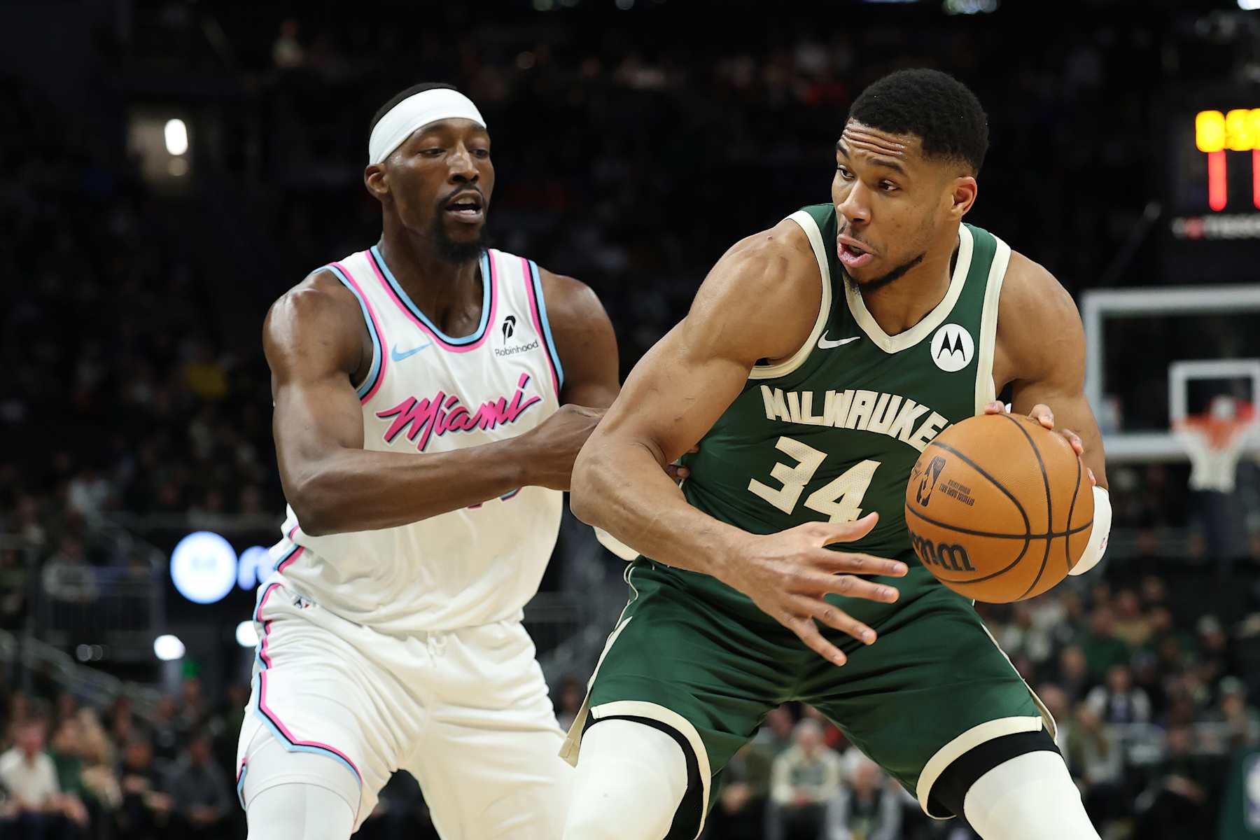 MILWAUKEE, WISCONSIN - JANUARY 23: Giannis Antetokounmpo #34 of the Milwaukee Bucks is defended by Bam Adebayo #13 of the Miami Heat during the first half of a game at Fiserv Forum on January 23, 2025 in Milwaukee, Wisconsin.  NOTE TO USER: User expressly acknowledges and agrees that, by downloading and or using this photograph, User is consenting to the terms and conditions of the Getty Images License Agreement. (Photo by Stacy Revere/Getty Images)