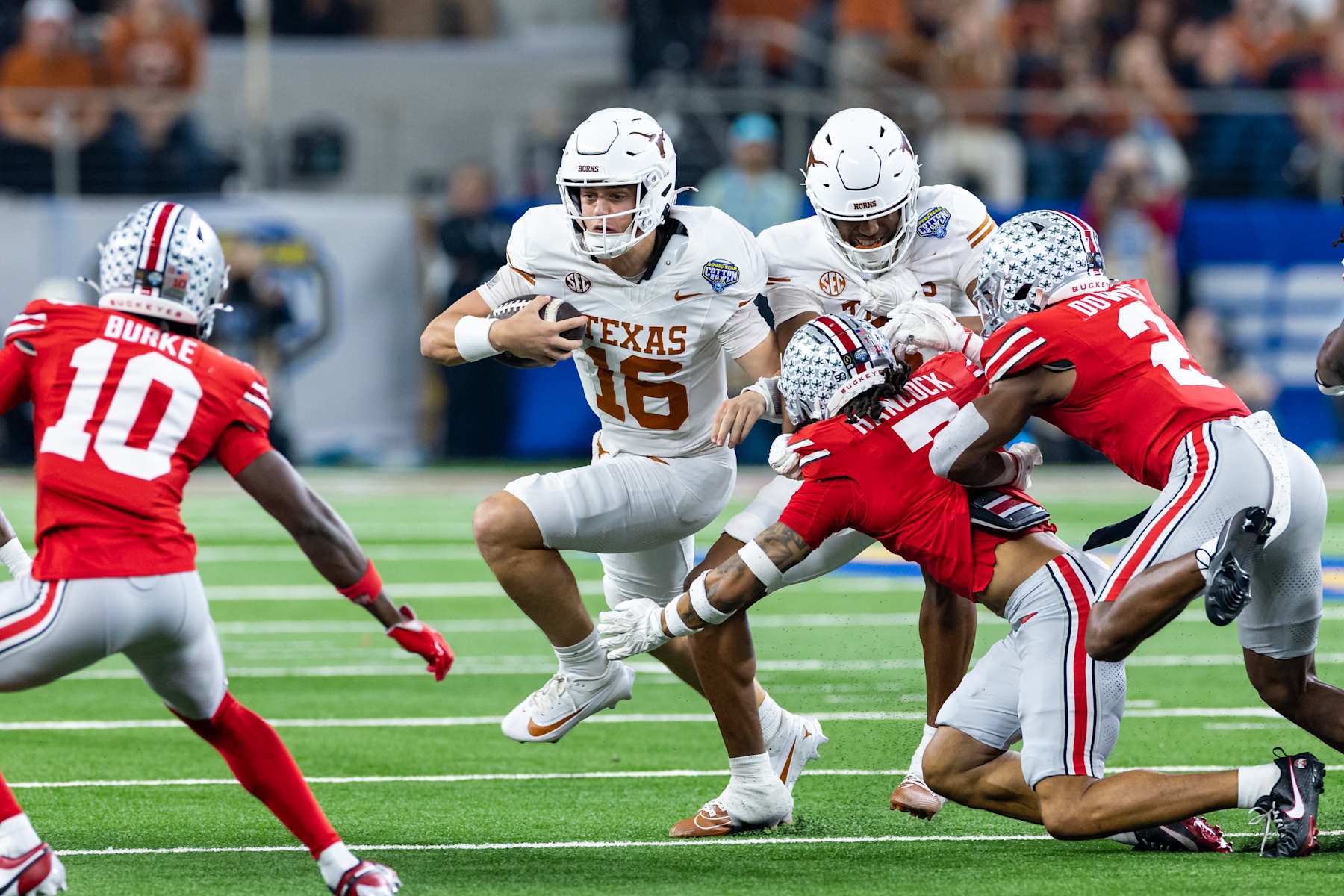 ARLINGTON, TX - JANUARY 10: Texas Longhorns quarterback Arch Manning (#16) runs up field for a first down during the CFP Semifinal Cotton Bowl Classic football game between the Ohio State Buckeyes and Texas Longhorns on January 10, 2025 at AT&T Stadium in Arlington, TX. (Photo by Matthew Visinsky/Icon Sportswire via Getty Images)