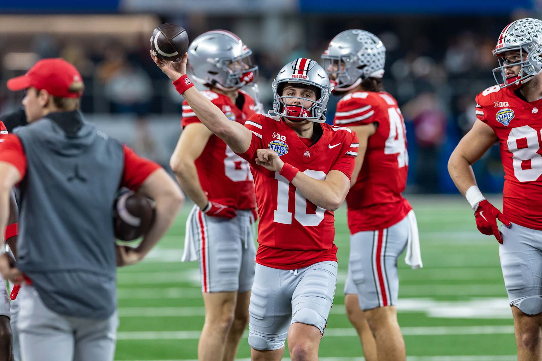 ARLINGTON, TX - JANUARY 10: Ohio State Buckeyes quarterback Julian Sayin (#10) warms up on the sideline during the CFP Semifinal Cotton Bowl Classic football game between the Ohio State Buckeyes and Texas Longhorns on January 10, 2025 at AT&T Stadium in Arlington, TX. (Photo by Matthew Visinsky/Icon Sportswire via Getty Images)