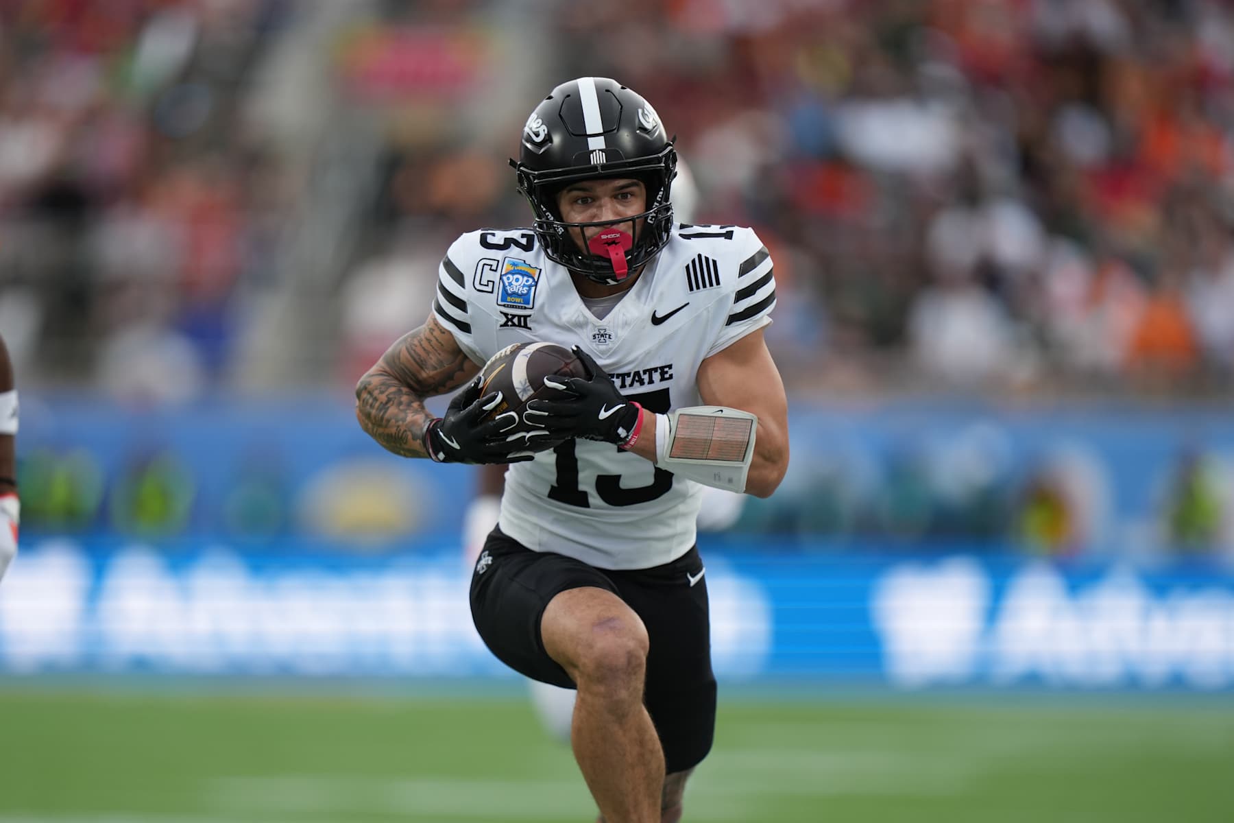 ORLANDO, FL - DECEMBER 28: Iowa State Cyclones wide receiver Jaylin Noel (13) runs after a catch during the Pop-Tarts Bowl game between the Iowa State Cyclones and the Miami Hurricanes on Saturday, December 28, 2024 at Camping World Stadium in Orlando, Fla. (Photo by Peter Joneleit/Icon Sportswire via Getty Images)