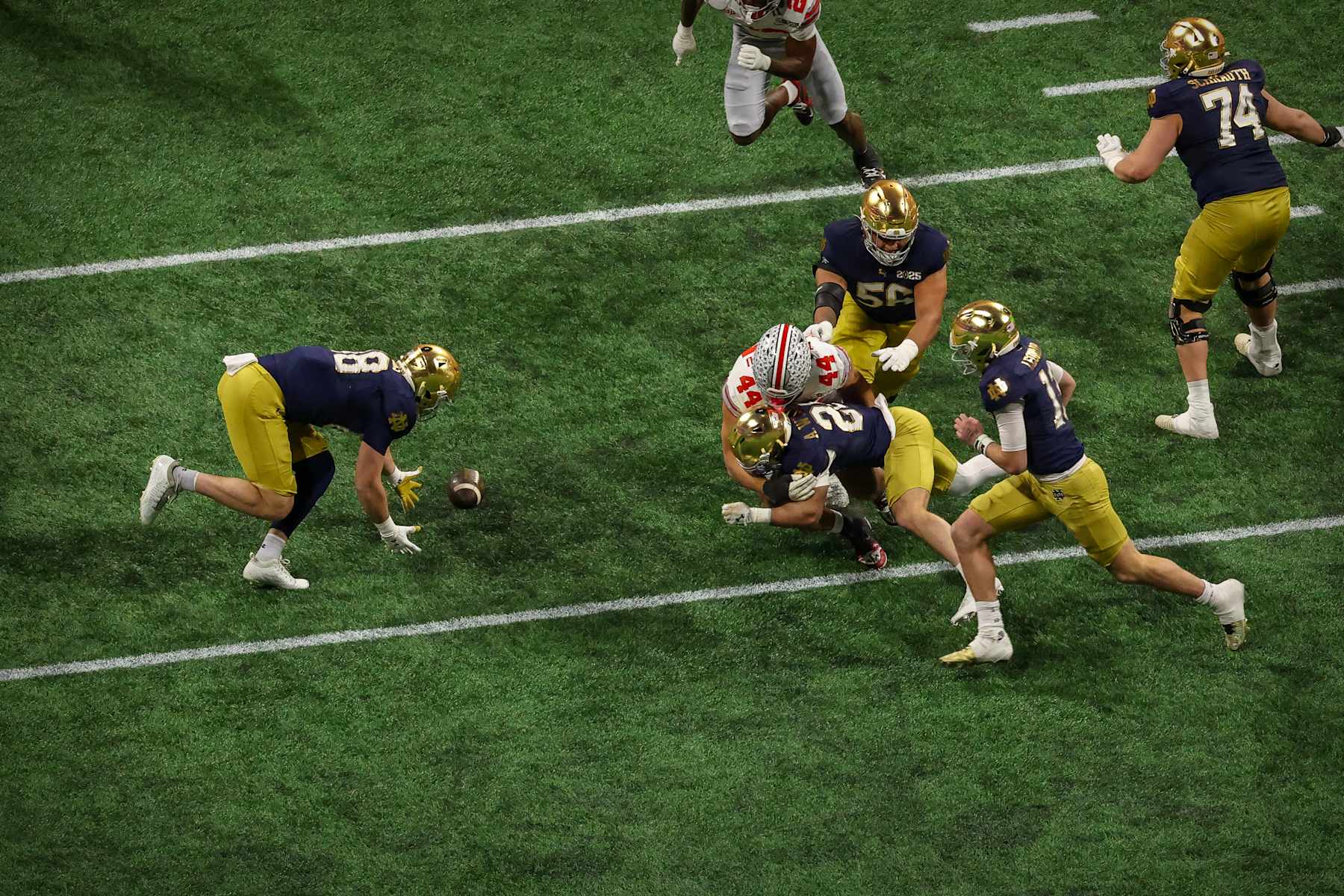 ATLANTA, GEORGIA - JANUARY 20: Armel Mukam #88 of the Notre Dame Fighting Irish recovers a fumble by JT Tuimoloau #44 of the Ohio State Buckeyes during the 2025 CFP National Championship Game at Mercedes-Benz Stadium on January 20, 2025 in Atlanta, Georgia. (Photo by CFP/Getty Images)