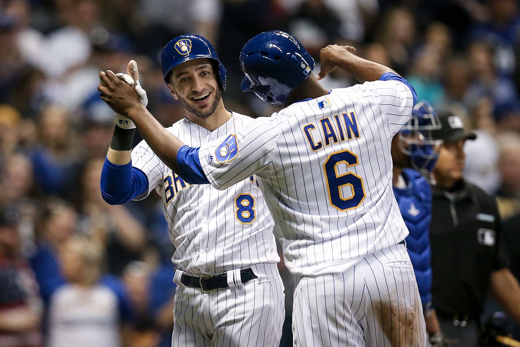 MILWAUKEE, WISCONSIN - APRIL 20: Lorenzo Cain #6 and Ryan Braun #8 of the Milwaukee Brewers celebrate after Braun hit a home run in the seventh inning against the Los Angeles Dodgers at Miller Park on April 20, 2019 in Milwaukee, Wisconsin. (Photo by Dylan Buell/Getty Images)