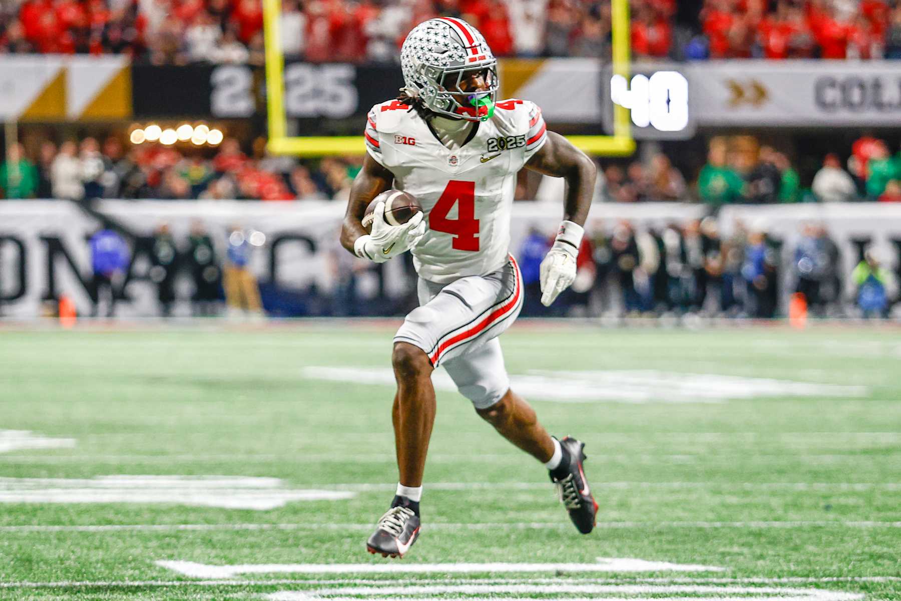 ATLANTA, GEORGIA - JANUARY 20: Jeremiah Smith #4 of Ohio State runs for a touchdown during the National Championship game between Ohio State and Notre Dame at Mercedes-Benz Stadium on January 20, 2025 in Atlanta, GA. (Photo by Michael Miller/ISI Photos/Getty Images)