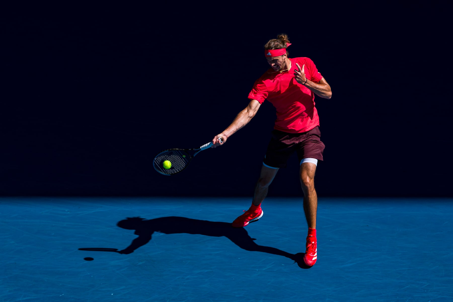 MELBOURNE, AUSTRALIA - JANUARY 24: Alexander Zverev of Germany plays a forehand against Novak Djokovic of Serbia during the Men's Singles Semi-final during day 13 of the 2025 Australian Open at Melbourne Park on January 24, 2025 in Melbourne, Australia. (Photo by Andy Cheung/Getty Images)