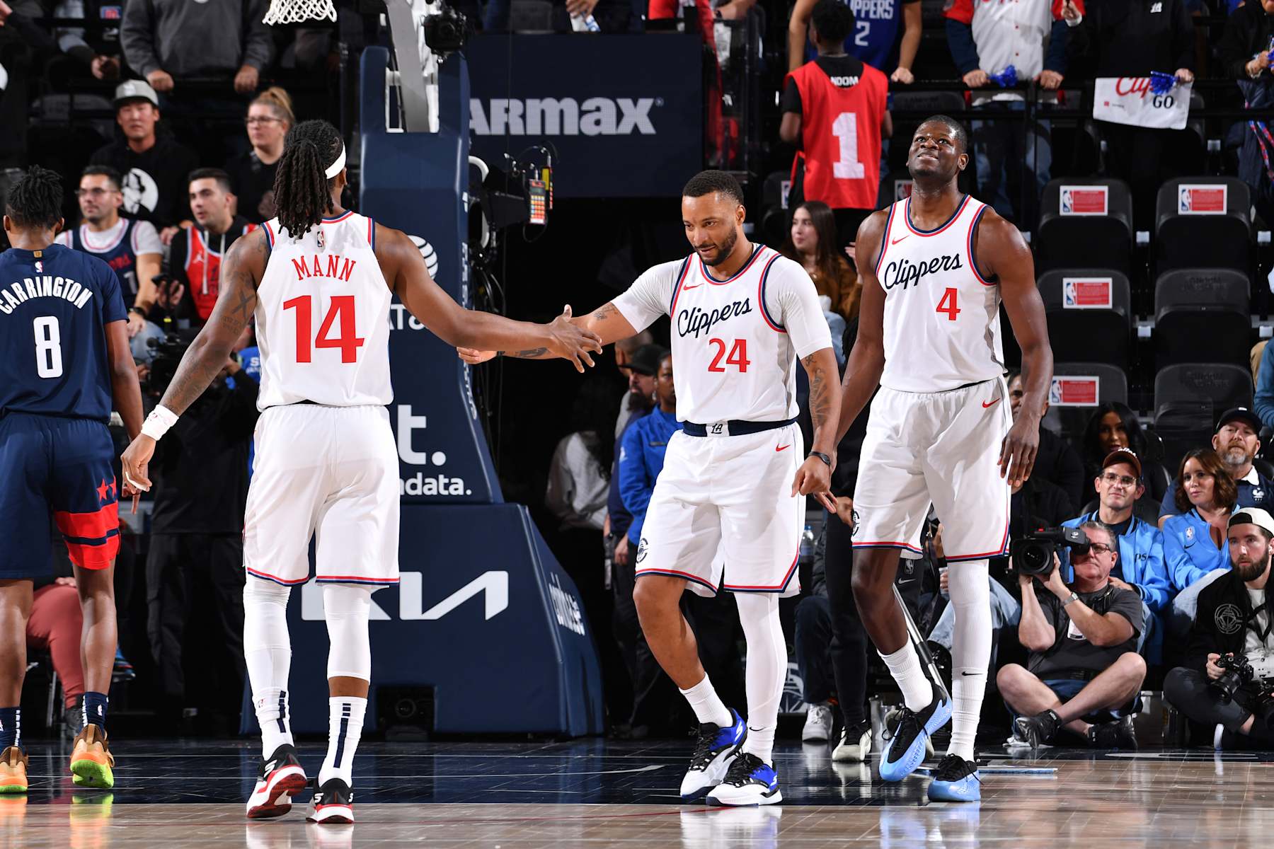 INGLEWOOD, CA - JANUARY 23: Terance Mann #14 high fives Norman Powell #24 of the LA Clippers during the game against the Washington Wizards on January 23, 2025 at Intuit Dome in Los Angeles, California. NOTE TO USER: User expressly acknowledges and agrees that, by downloading and/or using this Photograph, user is consenting to the terms and conditions of the Getty Images License Agreement. Mandatory Copyright Notice: Copyright 2025 NBAE (Photo by Juan Ocampo/NBAE via Getty Images)