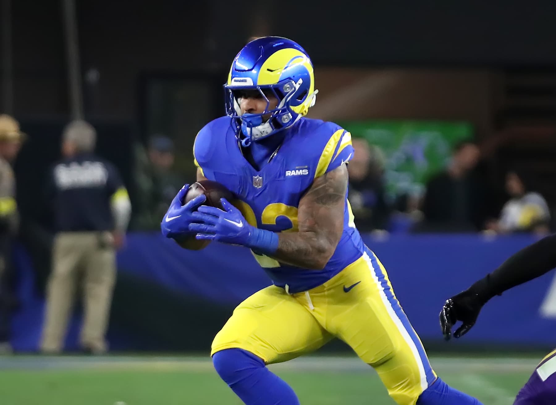 GLENDALE, ARIZONA - JANUARY 13: Runningback Kyren Williams #23 of the LA Rams rushes for positive yards during the first half of the Minnesota Vikings versus Los Angeles Rams NFL Wild Card football game at State Farm Stadium on January 13, 2025 in Glendale, Arizona. (Photo by Bruce Yeung/Getty Images)