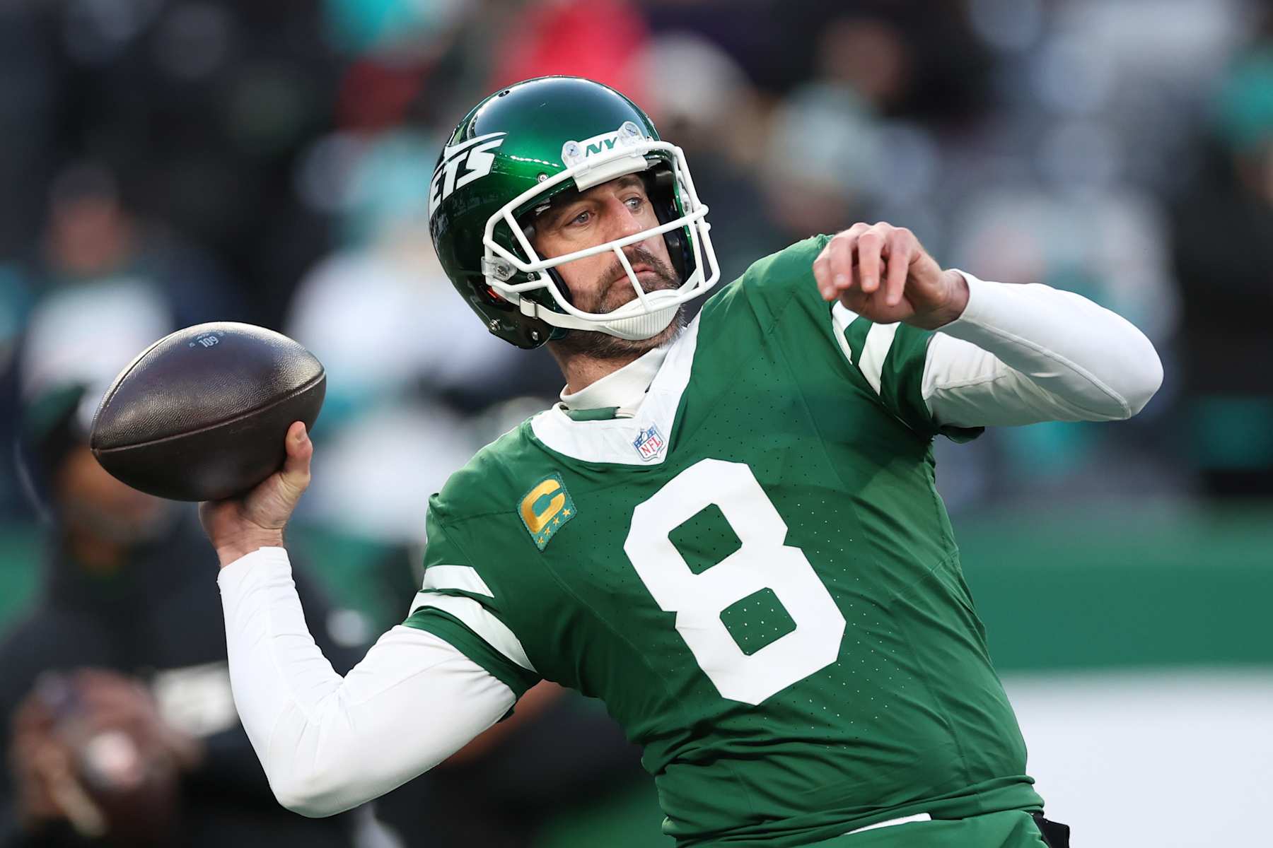 EAST RUTHERFORD, NEW JERSEY - JANUARY 05: Aaron Rodgers #8 of the New York Jets warms up before the game against the Miami Dolphins at MetLife Stadium on January 05, 2025 in East Rutherford, New Jersey. (Photo by Luke Hales/Getty Images)