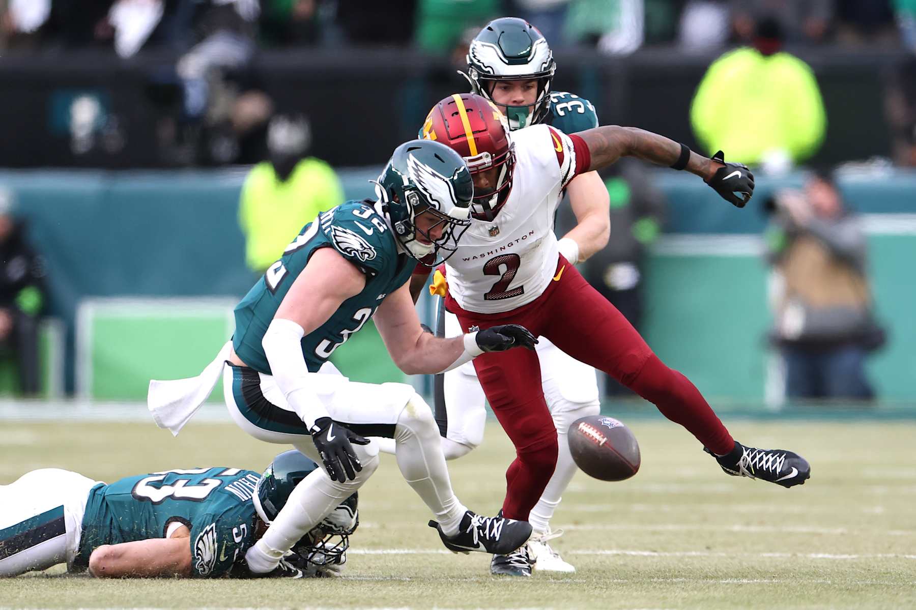 PHILADELPHIA, PENNSYLVANIA - JANUARY 26: Reed Blankenship #32 of the Philadelphia Eagles recovers a fumble against Dyami Brown #2 of the Washington Commanders during the first quarter in the NFC Championship Game at Lincoln Financial Field on January 26, 2025 in Philadelphia, Pennsylvania.  (Photo by Emilee Chinn/Getty Images)