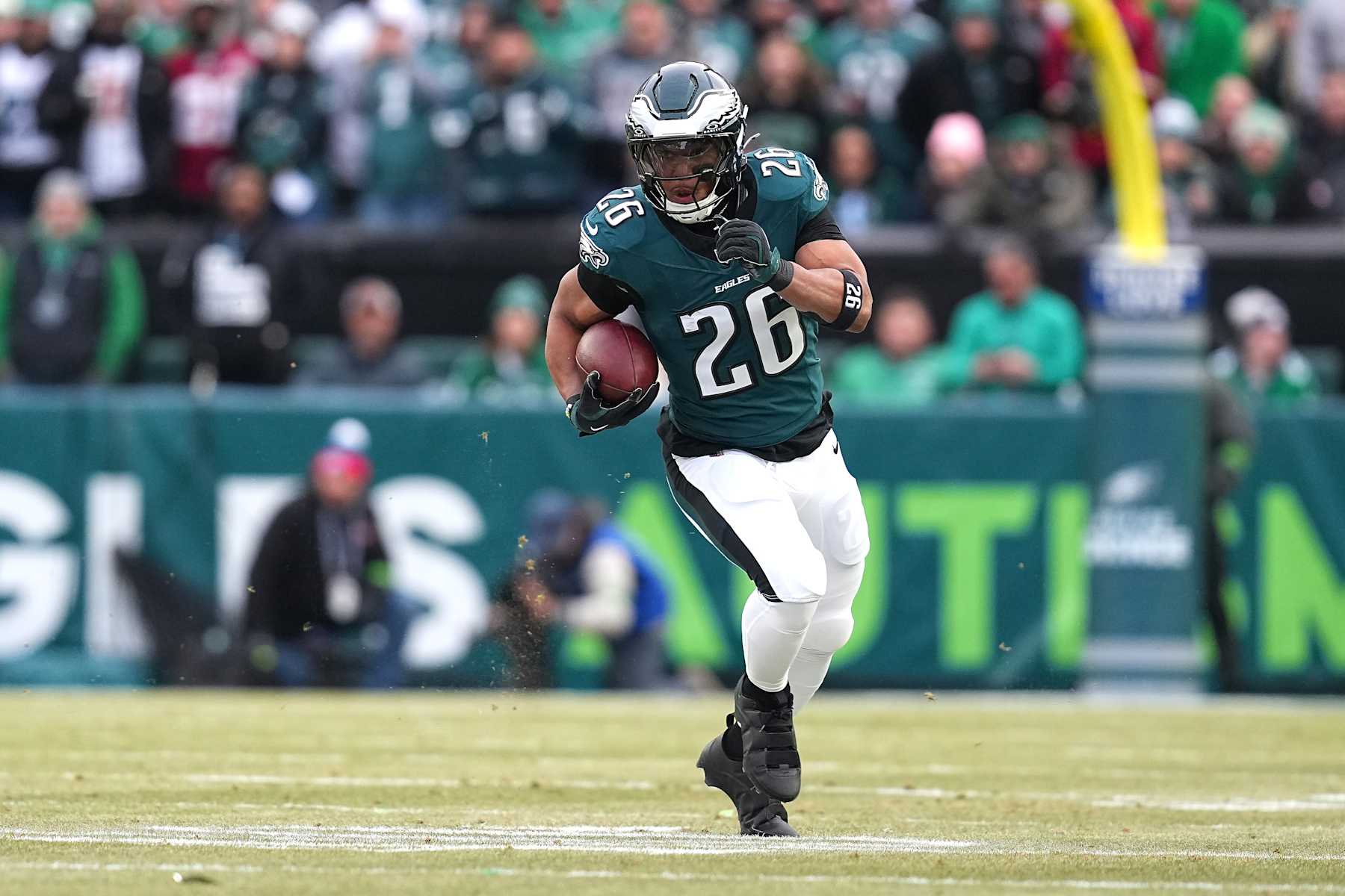PHILADELPHIA, PENNSYLVANIA - JANUARY 26: Saquon Barkley #26 of the Philadelphia Eagles runs the ball to score a 60 yard touchdown against the Washington Commanders during the first quarter in the NFC Championship Game at Lincoln Financial Field on January 26, 2025 in Philadelphia, Pennsylvania. (Photo by Mitchell Leff/Getty Images)