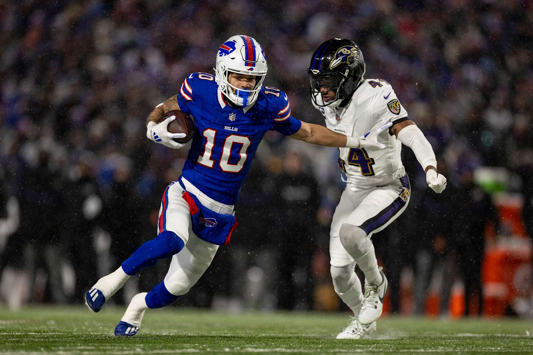 ORCHARD PARK, NEW YORK - JANUARY 19: Khalil Shakir #10 of the Buffalo Bills runs with the ball against Marlon Humphrey #44 of the Baltimore Ravens during an NFL Football game at Highmark Stadium on January 19, 2025 in Orchard Park, New York. (Photo by Michael Owens/Getty Images)