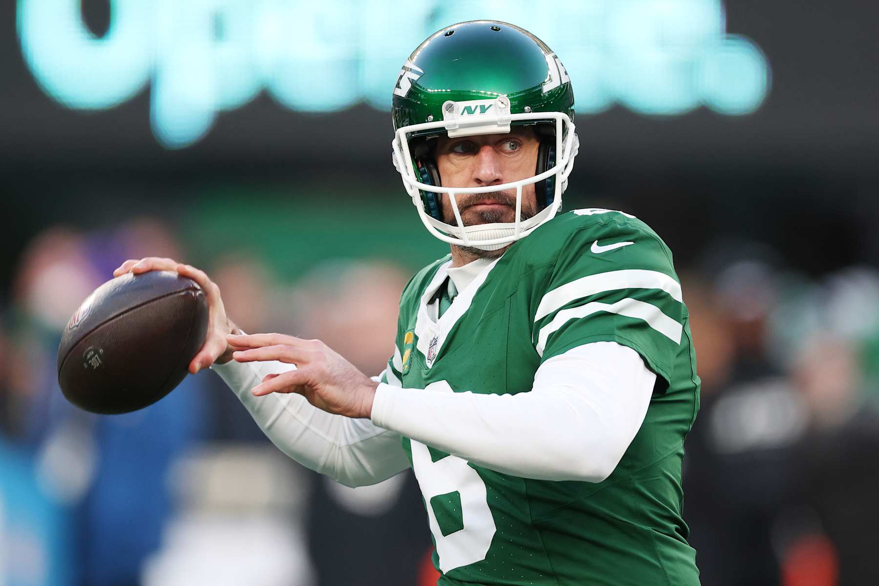 EAST RUTHERFORD, NEW JERSEY - JANUARY 05: Aaron Rodgers #8 of the New York Jets warms up before the game against the Miami Dolphins at MetLife Stadium on January 05, 2025 in East Rutherford, New Jersey. (Photo by Al Bello/Getty Images)