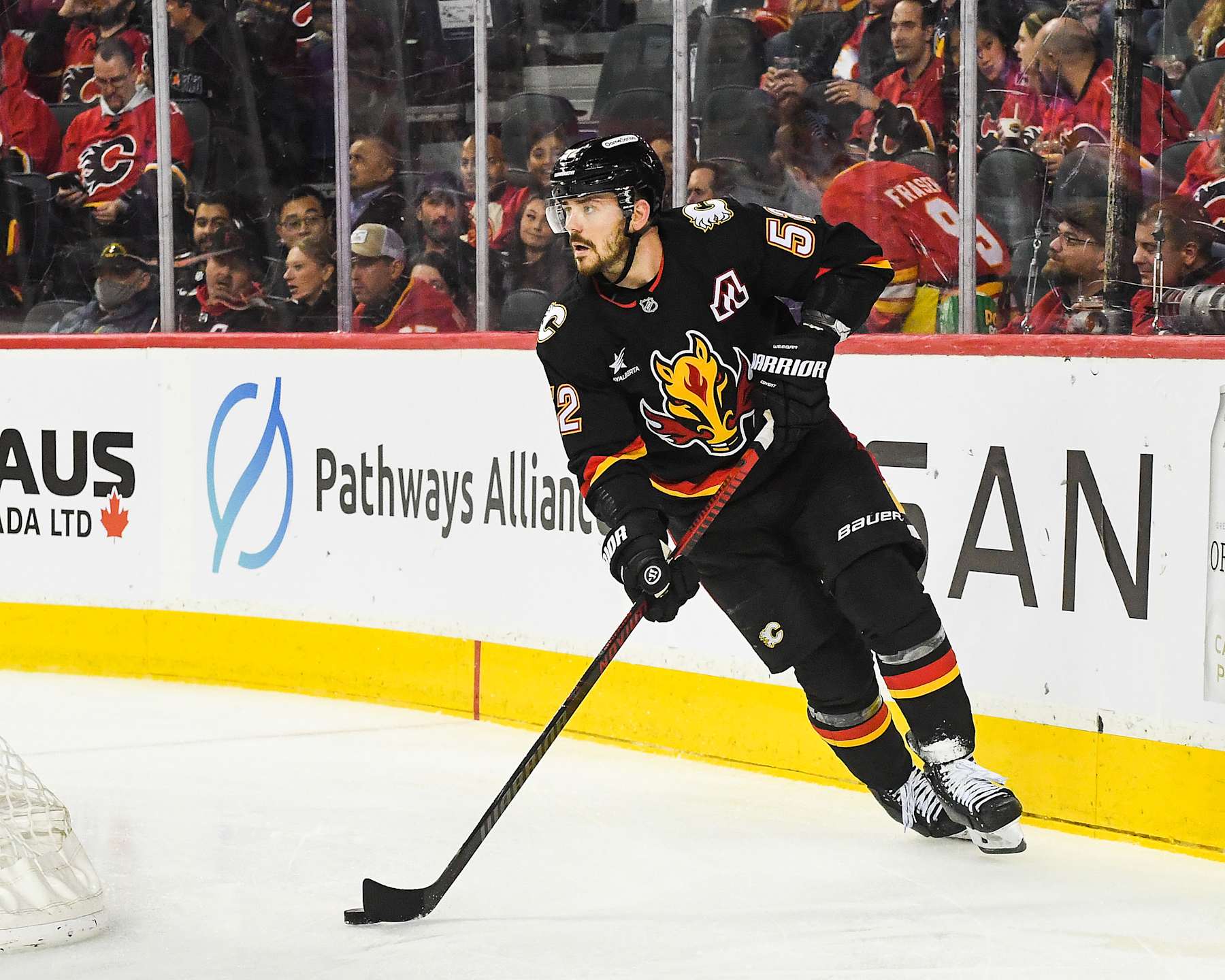 CALGARY, CANADA - JANUARY 11: MacKenzie Weegar #52 of the Calgary Flames in action against the Los Angeles Kings during an NHL game at Scotiabank Saddledome on January 11, 2025 in Calgary, Alberta, Canada. (Photo by Derek Leung/Getty Images)