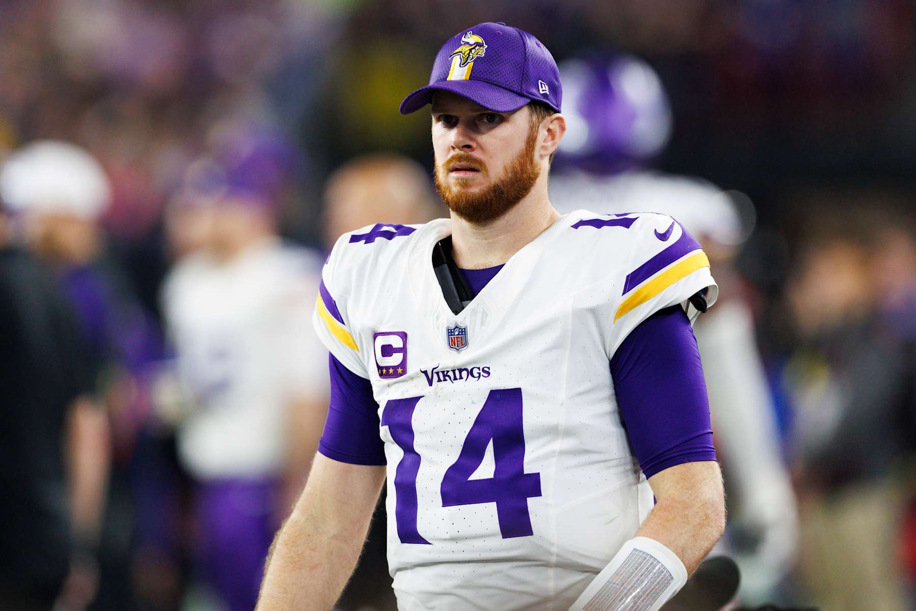 GLENDALE, ARIZONA - JANUARY 13: Sam Darnold #14 of the Minnesota Vikings on the sideline during the second half of the NFC Wild Card Playoff game against the Los Angeles Rams at State Farm Stadium on January 13, 2025 in Glendale, Arizona. (Photo by Ric Tapia/Getty Images)