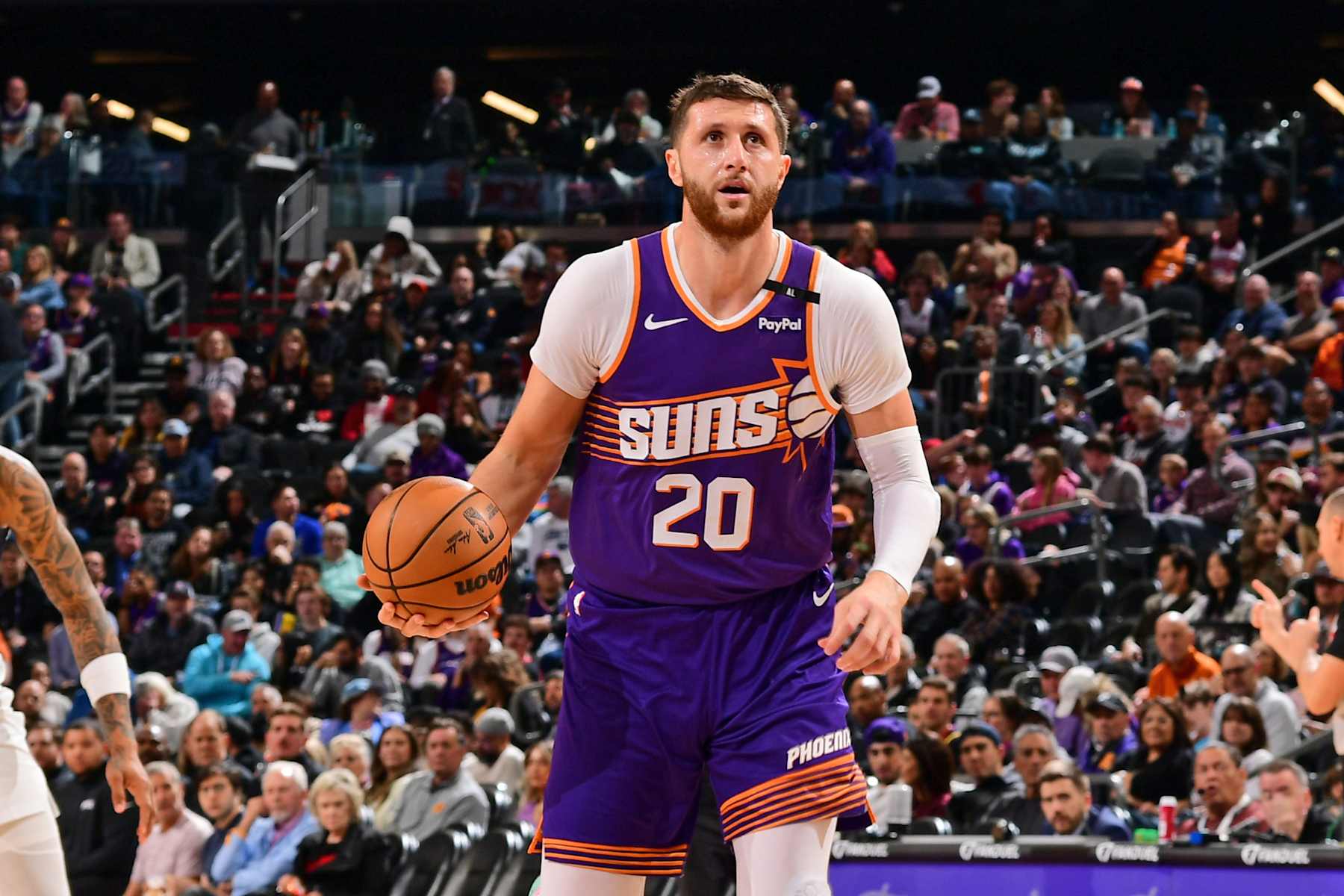 PHOENIX, AZ - DECEMBER 27: Jusuf Nurkic #20 of the Phoenix Suns handles the ball during the game against the Dallas Mavericks on December 27, 2024 at Footprint Center in Phoenix, Arizona. NOTE TO USER: User expressly acknowledges and agrees that, by downloading and or using this photograph, user is consenting to the terms and conditions of the Getty Images License Agreement. Mandatory Copyright Notice: Copyright 2024 NBAE (Photo by Kate Frese/NBAE via Getty Images)