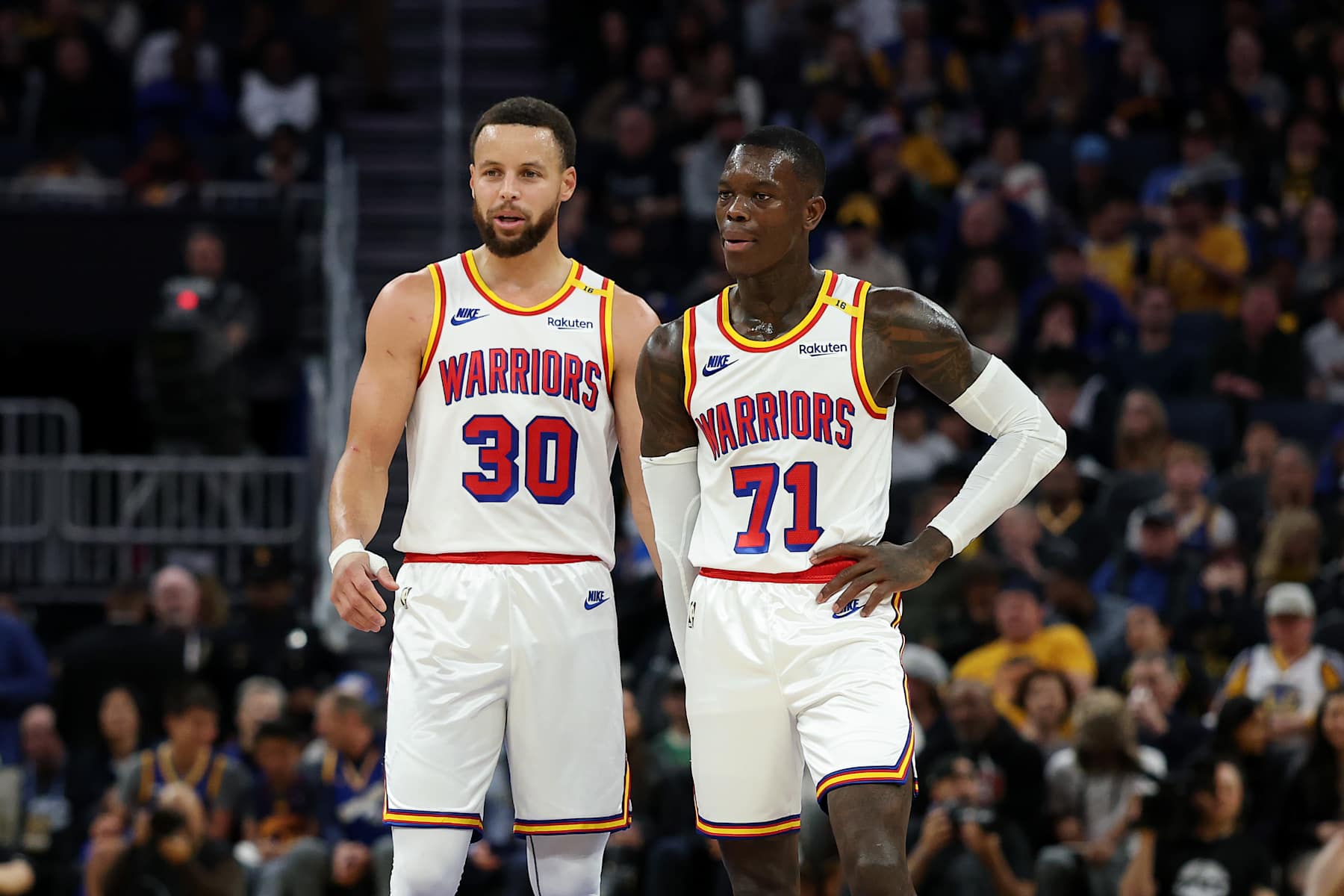 SAN FRANCISCO, CALIFORNIA - JANUARY 02: Stephen Curry #30 stands on the court with Dennis Schroder #71 of the Golden State Warriors during their game against the Philadelphia 76ers during the second half at Chase Center on January 02, 2025 in San Francisco, California. NOTE TO USER: User expressly acknowledges and agrees that, by downloading and/or using this photograph, user is consenting to the terms and conditions of the Getty Images License Agreement. (Photo by Ezra Shaw/Getty Images)