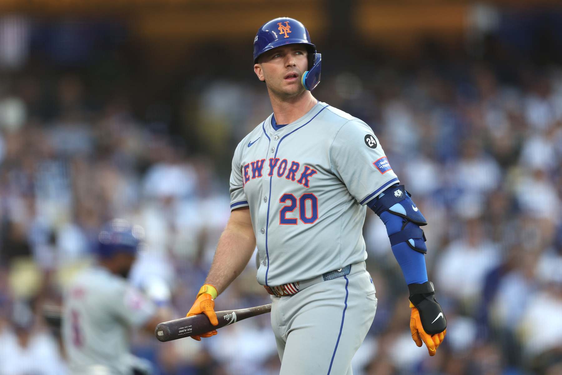 LOS ANGELES, CALIFORNIA - OCTOBER 13: Pete Alonso #20 of the New York Mets walks back to the dugout after striking out in the second inning against the Los Angeles Dodgers during Game One of the Championship Series at Dodger Stadium on October 13, 2024 in Los Angeles, California. (Photo by Harry How/Getty Images)