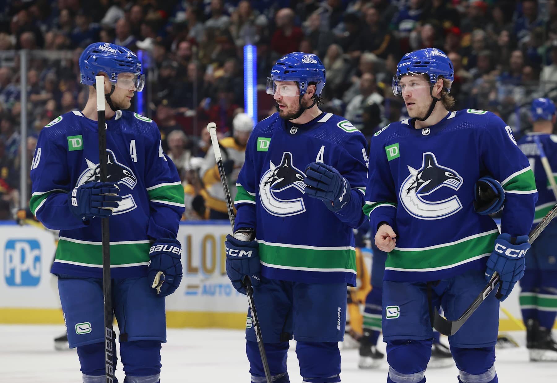 Elias Pettersson, J.T. Miller and Brock Boeser.