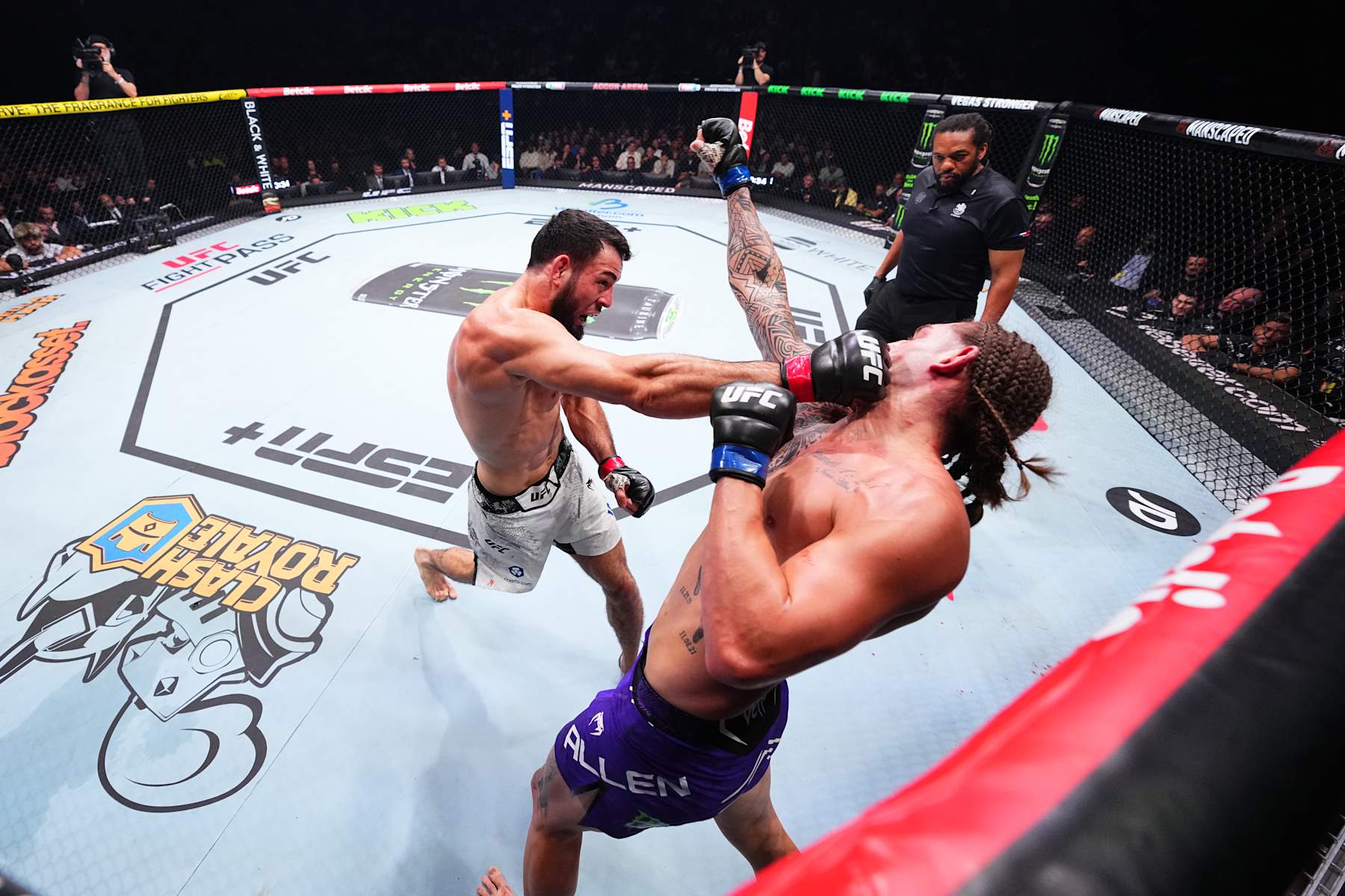 Nassourdine Imavov punches Brendan Allen.