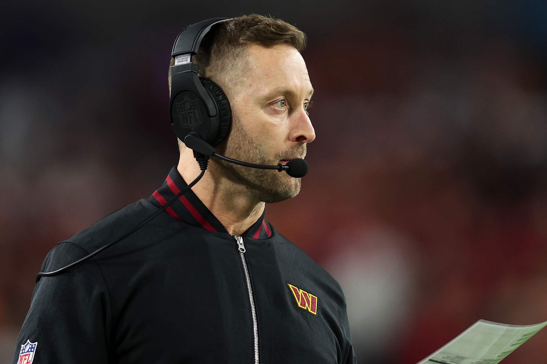 TAMPA, FLORIDA - JANUARY 12:  Washington Commanders offensive coordinator Kliff Kingsbury looks on from the sideline during an NFL football wild card playoff game against the Tampa Bay Buccaneers at Raymond James Stadium on January 12, 2025 in Tampa, Florida. (Photo by Perry Knotts/Getty Images)