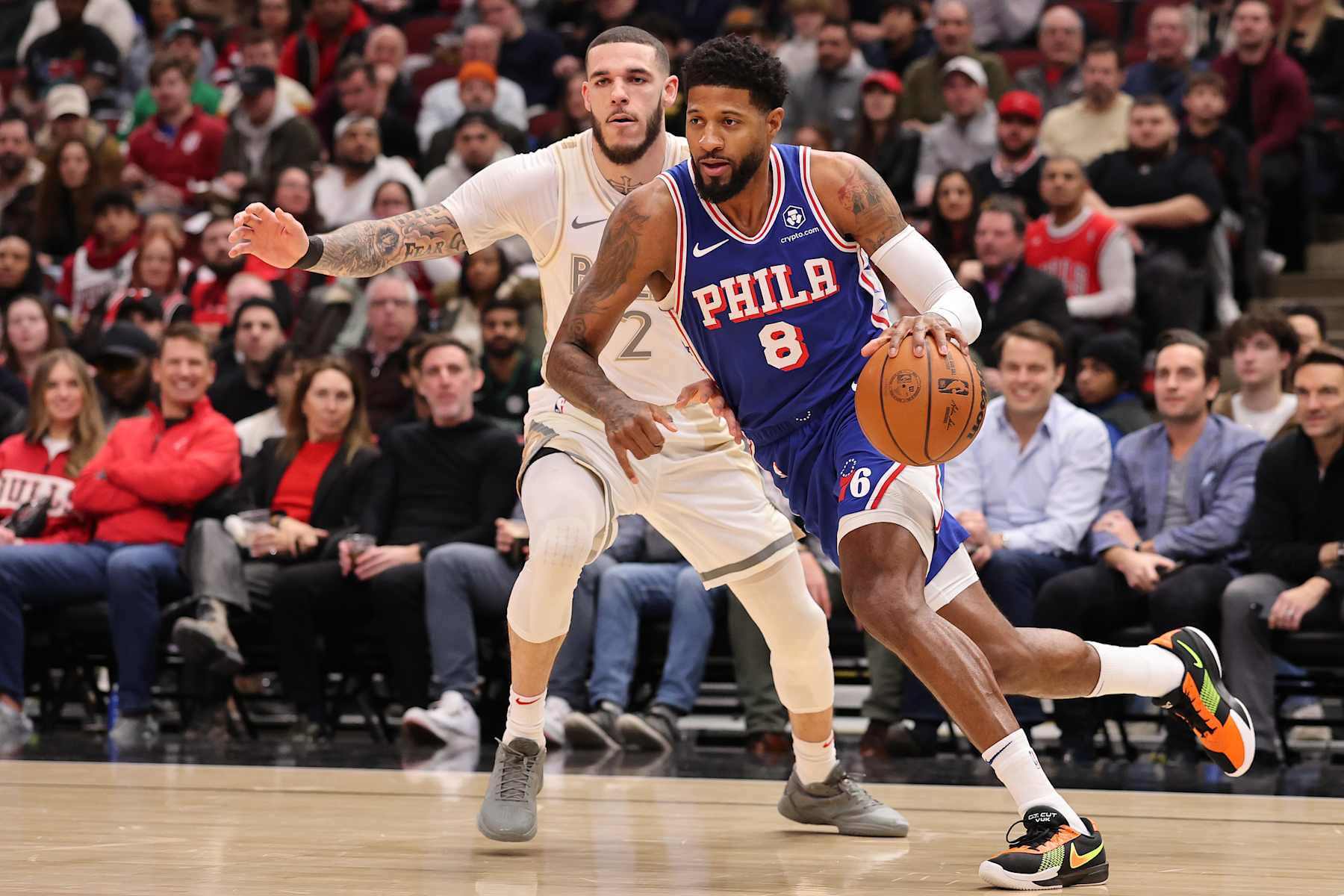 CHICAGO, ILLINOIS - JANUARY 25: Paul George #8 of the Philadelphia 76ers drives to the basket against Lonzo Ball #2 of the Chicago Bulls during the first half at the United Center on January 25, 2025 in Chicago, Illinois. NOTE TO USER: User expressly acknowledges and agrees that, by downloading and or using this photograph, User is consenting to the terms and conditions of the Getty Images License Agreement. (Photo by Michael Reaves/Getty Images)
