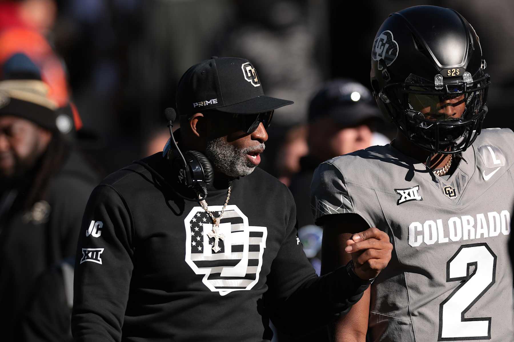 BOULDER, COLORADO - NOVEMBER 16: Head coach Deion Sanders of the Colorado Buffaloes and Shedeur Sanders #2 of Colorado Buffaloes walk the field prior to the game against the Utah Utes at Folsom Field on November 16, 2024 in Boulder, Colorado. (Photo by Andrew Wevers/Getty Images)