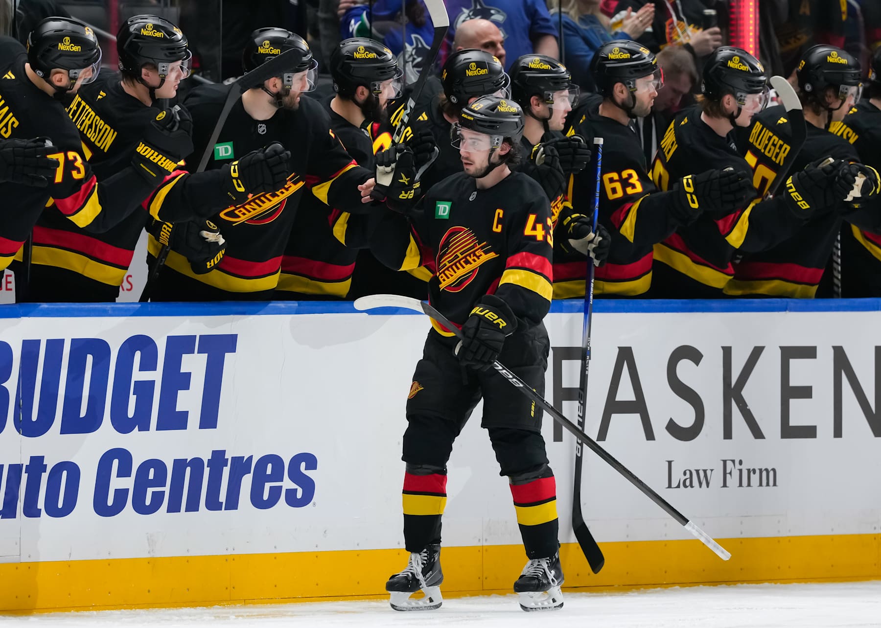 VANCOUVER, CANADA - JANUARY 25: Quinn Hughes #43 of the Vancouver Canucks skates past the bench after scoring during the second period of their NHL game against the Washington Capitals at Rogers Arena on January 25, 2025 in Vancouver, British Columbia, Canada. (Photo by Derek Cain/Getty Images)