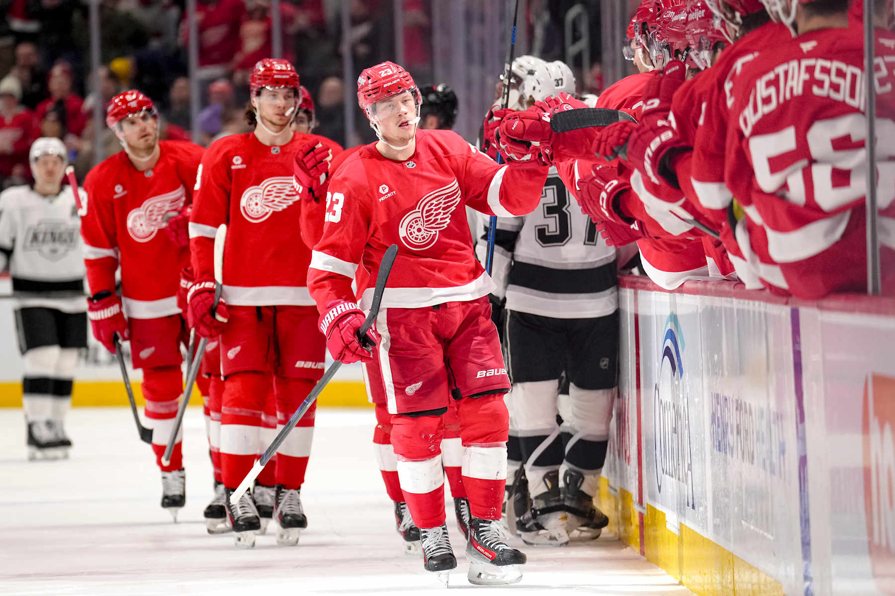 DETROIT, MICHIGAN - JANUARY 27: Lucas Raymond #23 of the Detroit Red Wings celebrates after scoring a goal against the Los Angeles Kings during the first period at Little Caesars Arena on January 27, 2025 in Detroit, Michigan. (Photo by Nic Antaya/Getty Images)
