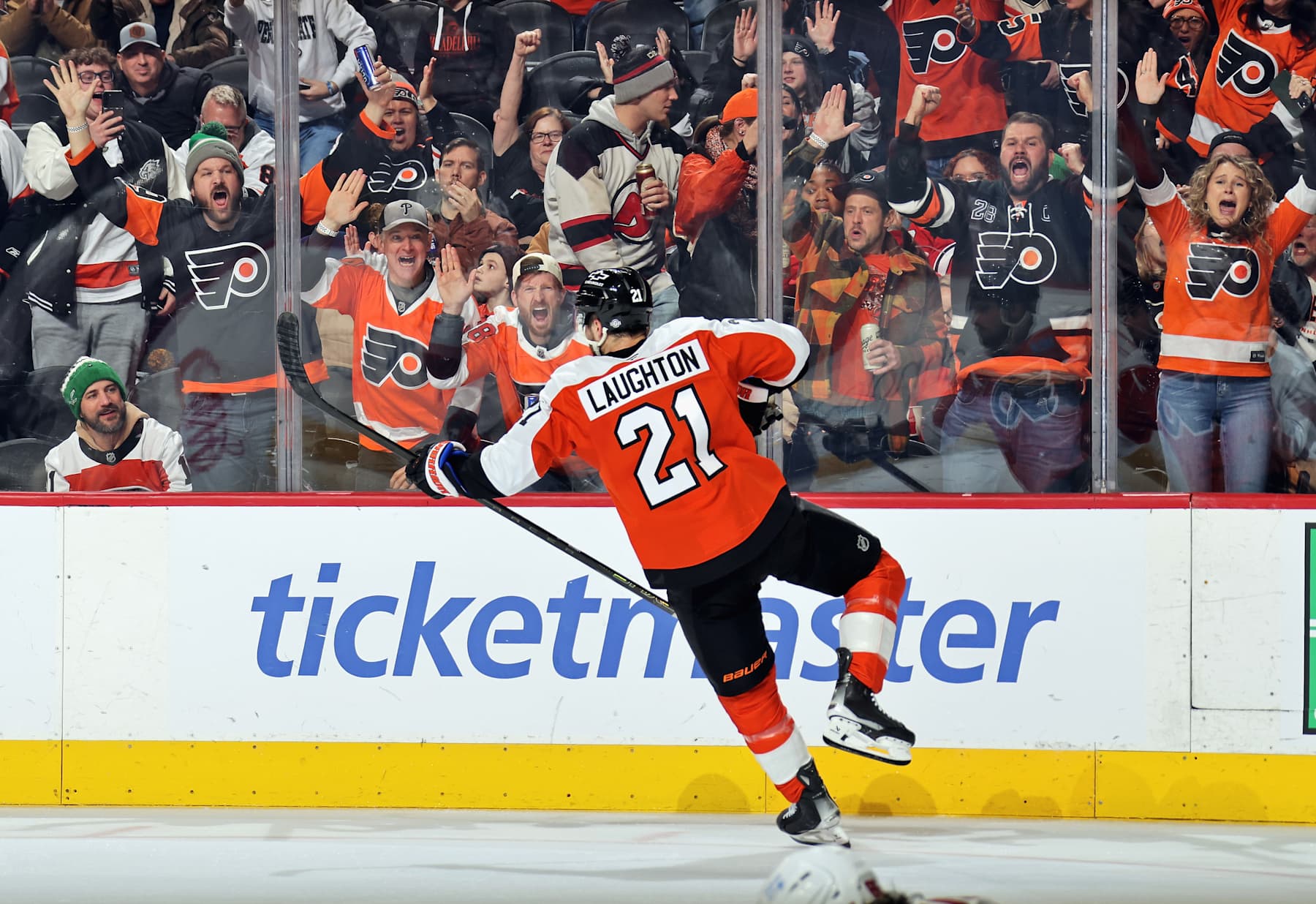 PHILADELPHIA, PENNSYLVANIA - JANUARY 27: Scott Laughton #21 of the Philadelphia Flyers in front of fans after scoring a third period empty-net goal against the New Jersey Devils at the Wells Fargo Center on January 27, 2025 in Philadelphia, Pennsylvania. The Flyers went on to defeat the Devils 4-2. (Photo by Len Redkoles/NHLI via Getty Images)