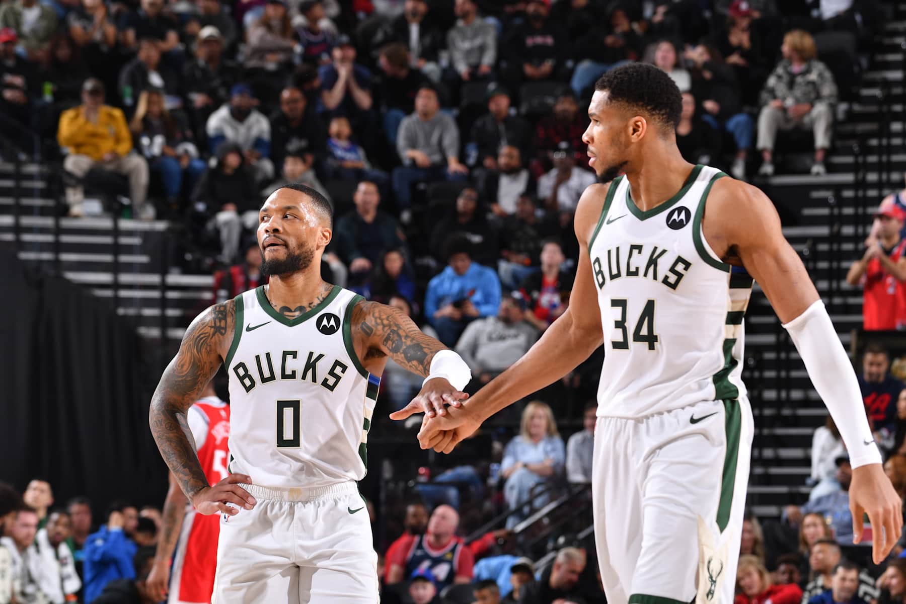 INGLEWOOD, CA - JANUARY 25: Damian Lillard #0 and Giannis Antetokounmpo #34 of the Milwaukee Bucks high five during the game against the LA Clippers on January 25, 2025 at Intuit Dome in Los Angeles, California. NOTE TO USER: User expressly acknowledges and agrees that, by downloading and/or using this Photograph, user is consenting to the terms and conditions of the Getty Images License Agreement. Mandatory Copyright Notice: Copyright 2025 NBAE (Photo by Juan Ocampo/NBAE via Getty Images)