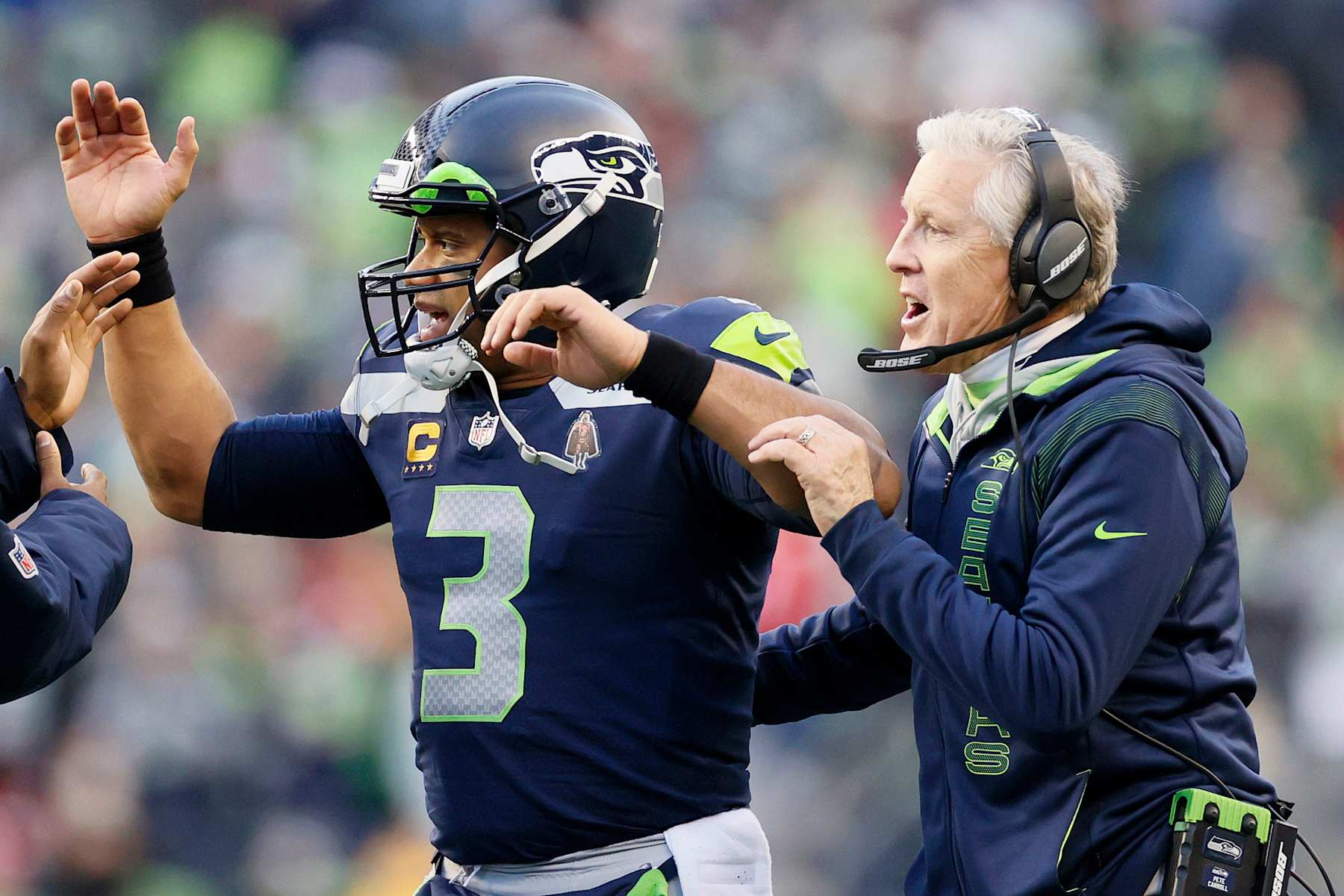 SEATTLE, WASHINGTON - DECEMBER 05: Russell Wilson #3 and head coach Pete Carroll of the Seattle Seahawks  react during the third quarter against the San Francisco 49ers at Lumen Field on December 05, 2021 in Seattle, Washington. (Photo by Steph Chambers/Getty Images)