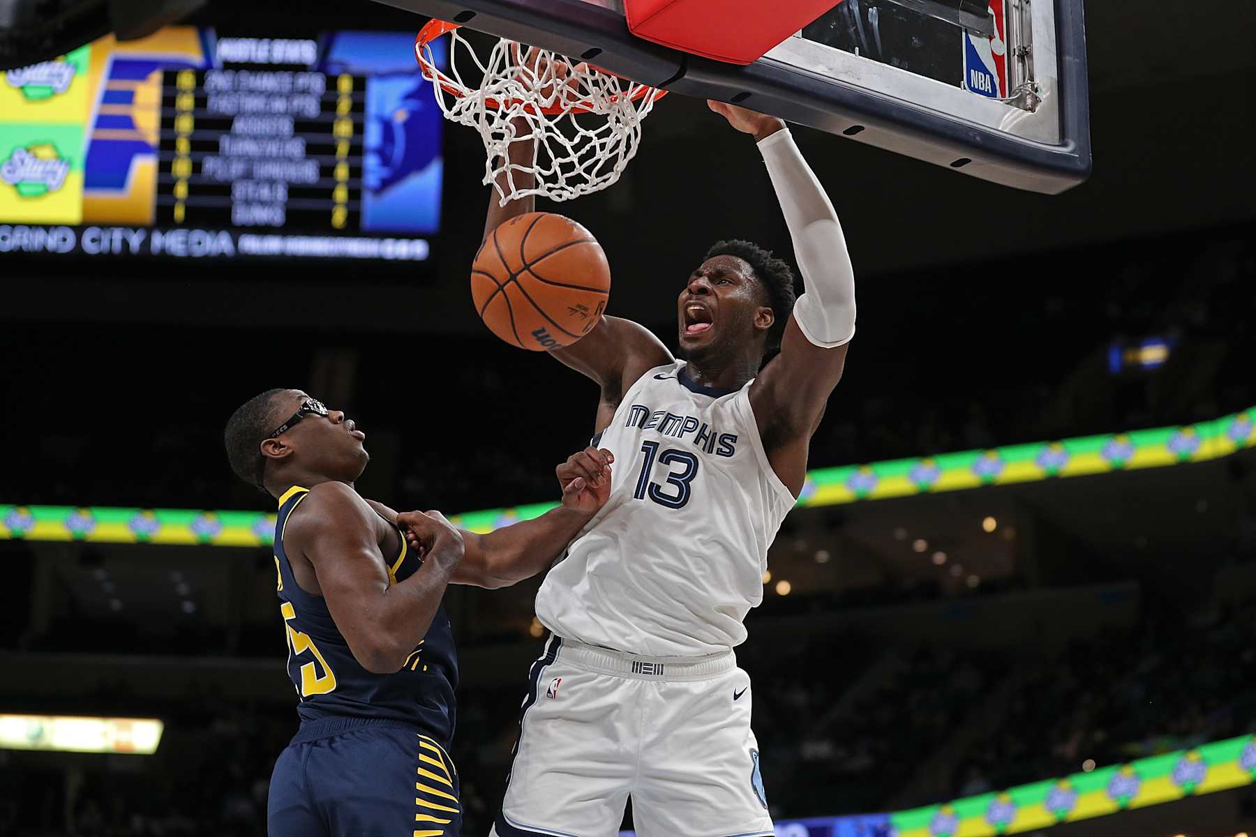 MEMPHIS, TENNESSEE - OCTOBER 08: Jaren Jackson Jr. #13 of the Memphis Grizzlies dunks during the second half against Jalen Smith #25 of the Indiana Pacers at FedExForum on October 08, 2023 in Memphis, Tennessee. NOTE TO USER: User expressly acknowledges and agrees that, by downloading and or using this photograph, User is consenting to the terms and conditions of the Getty Images License Agreement. (Photo by Justin Ford/Getty Images)