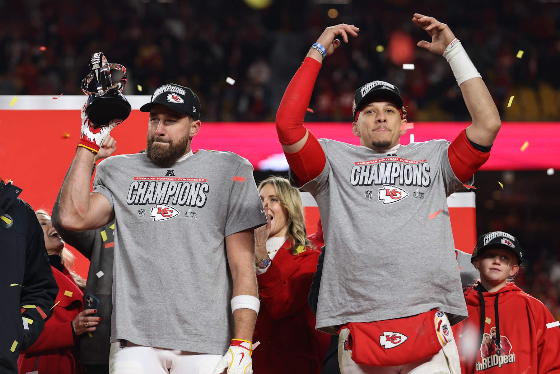 KANSAS CITY, MO - JANUARY 26: Kansas City Chiefs tight end Travis Kelce (87) and quarterback Patrick Mahomes (15) raise their hands and the Lamar Hunt trophy to celebrate winning the AFC Championship game against the Buffalo Bills on January 26, 2025 at GEHA Field at Arrowhead Stadium in Kansas City, MO. (Photo by Scott Winters/Icon Sportswire via Getty Images)