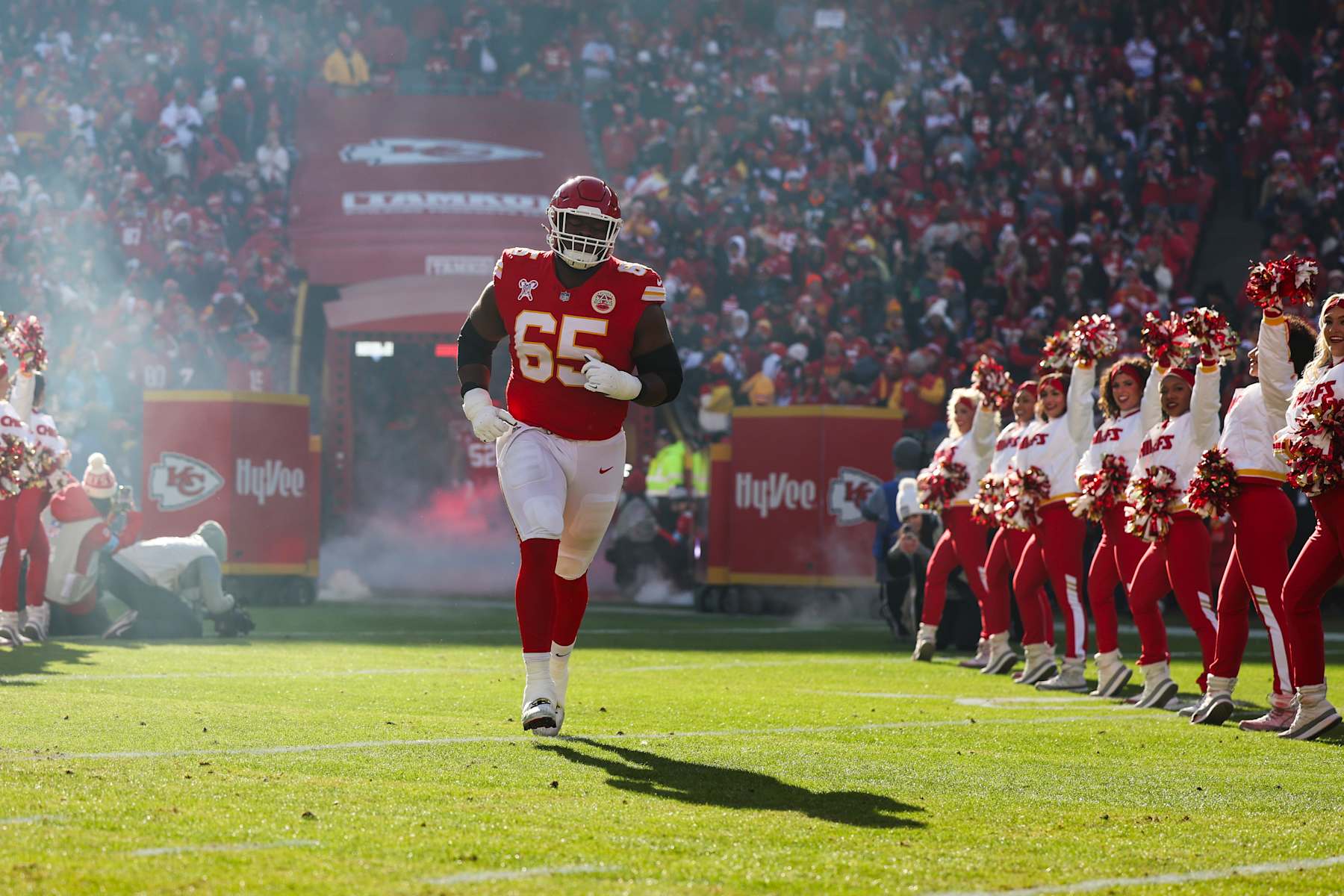 KANSAS CITY, MISSOURI - DECEMBER 21: Trey Smith #65 of the Kansas City Chiefs runs out of the tunnel prior to an NFL football game against the Houston Texans at GEHA Field at Arrowhead Stadium on December 21, 2024 in Kansas City, Missouri. (Photo by Perry Knotts/Getty Images)