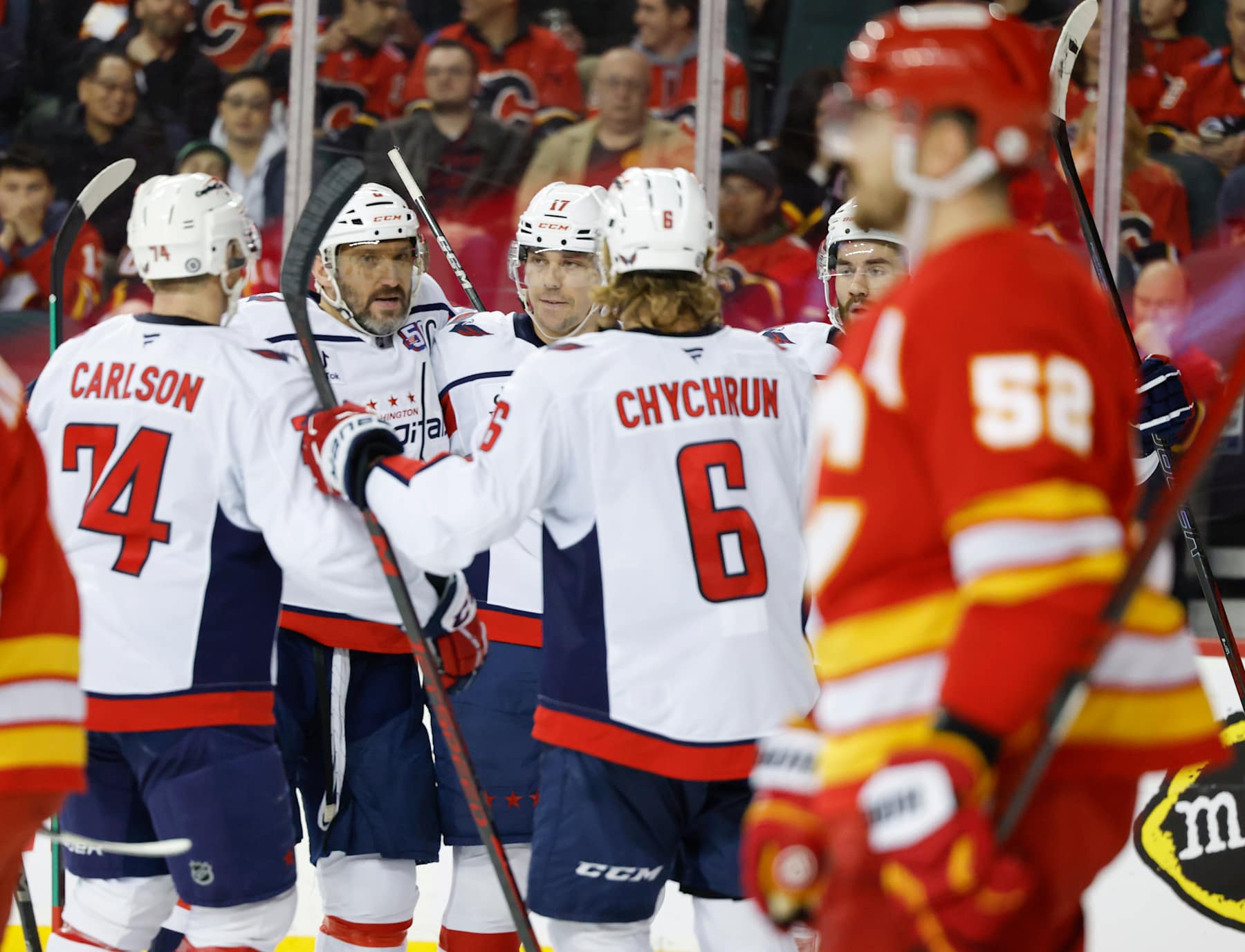 CALGARY, CANADA - JANUARY 28: Dylan Strome #17 of the Washington Capitals celebrates his second-period goal against the Calgary Flames with teammates at the Scotiabank Saddledome on January 28, 2025, in Calgary, Alberta, Canada. (Photo by Leah Hennel/Getty Images)