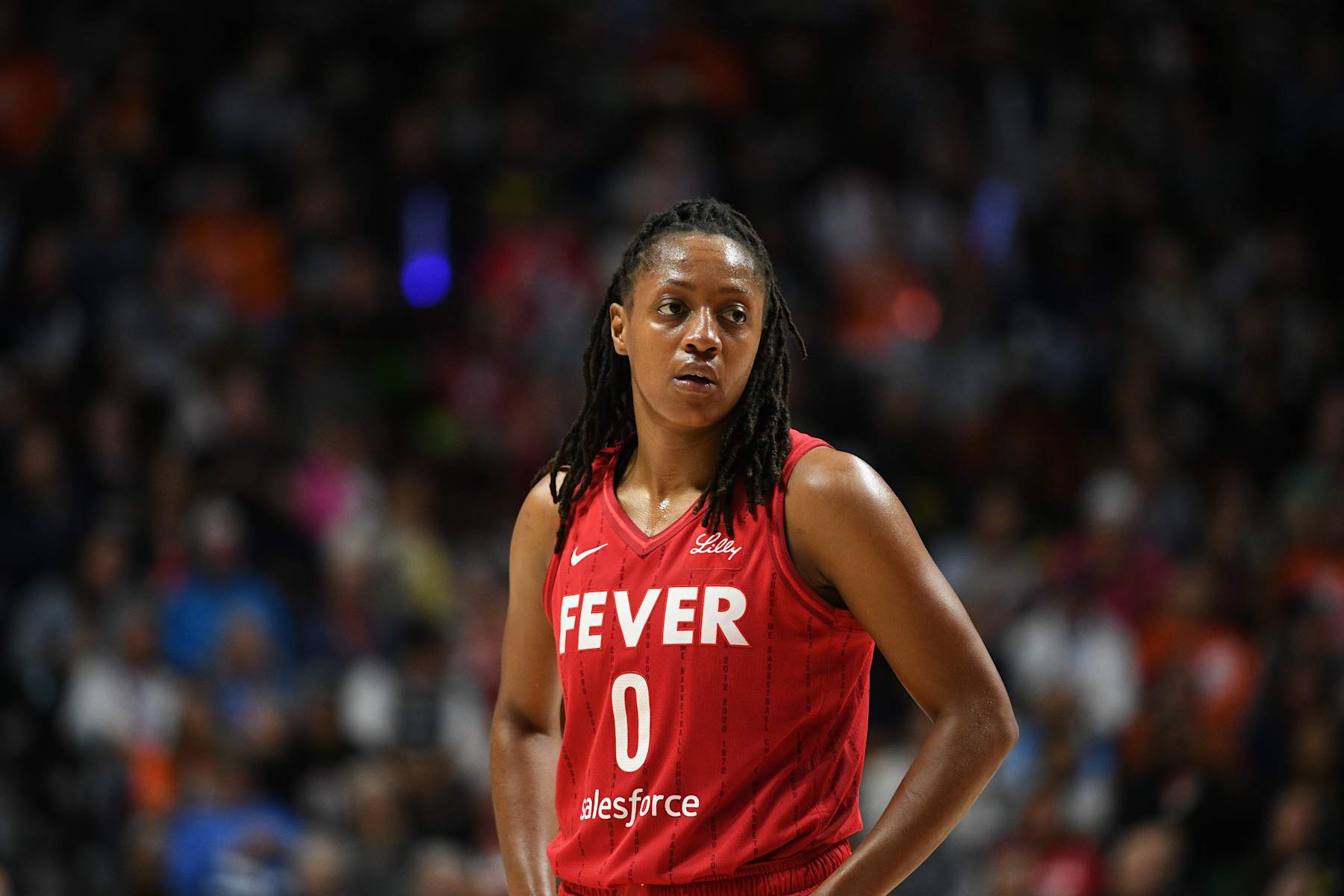 UNCASVILLE, CT - SEPTEMBER 25: Indiana Fever guard Kelsey Mitchell (0) looks on during game 2 of the first round of the WNBA Playoffs between the Indiana Fever and the Connecticut Sun on September 25, 2024, at Mohegan Sun Arena in Uncasville, CT. (Photo by Erica Denhoff/Icon Sportswire via Getty Images)
