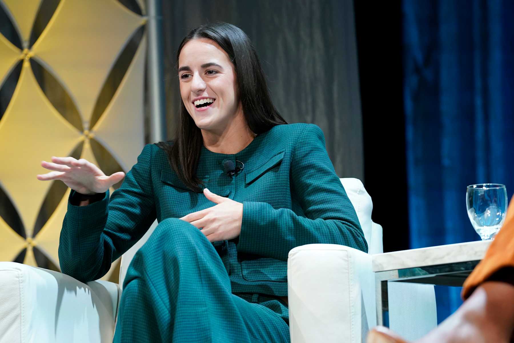 BOSTON, MASSACHUSETTS - DECEMBER 12: Caitlin Clark, Professional Basketball Player, speaks on stage during the 2024 Massachusetts Conference for Women at Boston Convention and Exhibition Center on December 12, 2024 in Boston, Massachusetts. (Photo by Marla Aufmuth/Getty Images for Massachusetts Conference for Women)