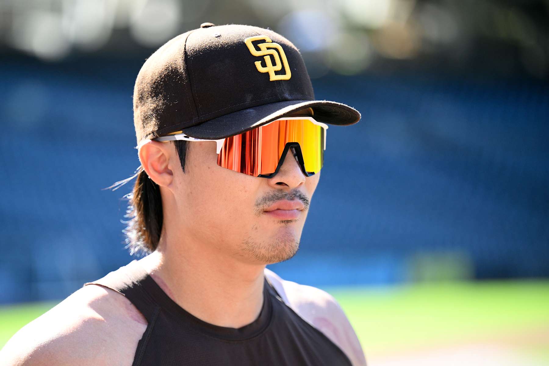 SAN DIEGO, CALIFORNIA - AUGUST 23: Ha-Seong Kim #7 of the San Diego Padres looks on before the game against the New York Mets at Petco Park on August 23, 2024 in San Diego, California. (Photo by Orlando Ramirez/Getty Images)
