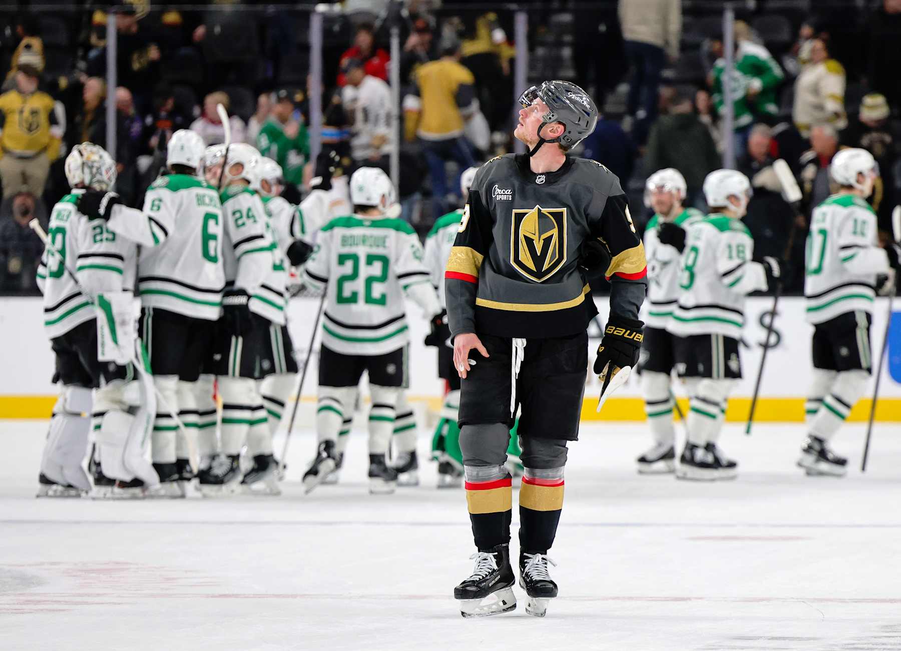 LAS VEGAS, NEVADA - JANUARY 28: Jack Eichel #9 of the Vegas Golden Knights skates off the ice as the Dallas Stars celebrate their 4-3 overtime victory over the Golden Knights behind him at T-Mobile Arena on January 28, 2025 in Las Vegas, Nevada. (Photo by Ethan Miller/Getty Images)