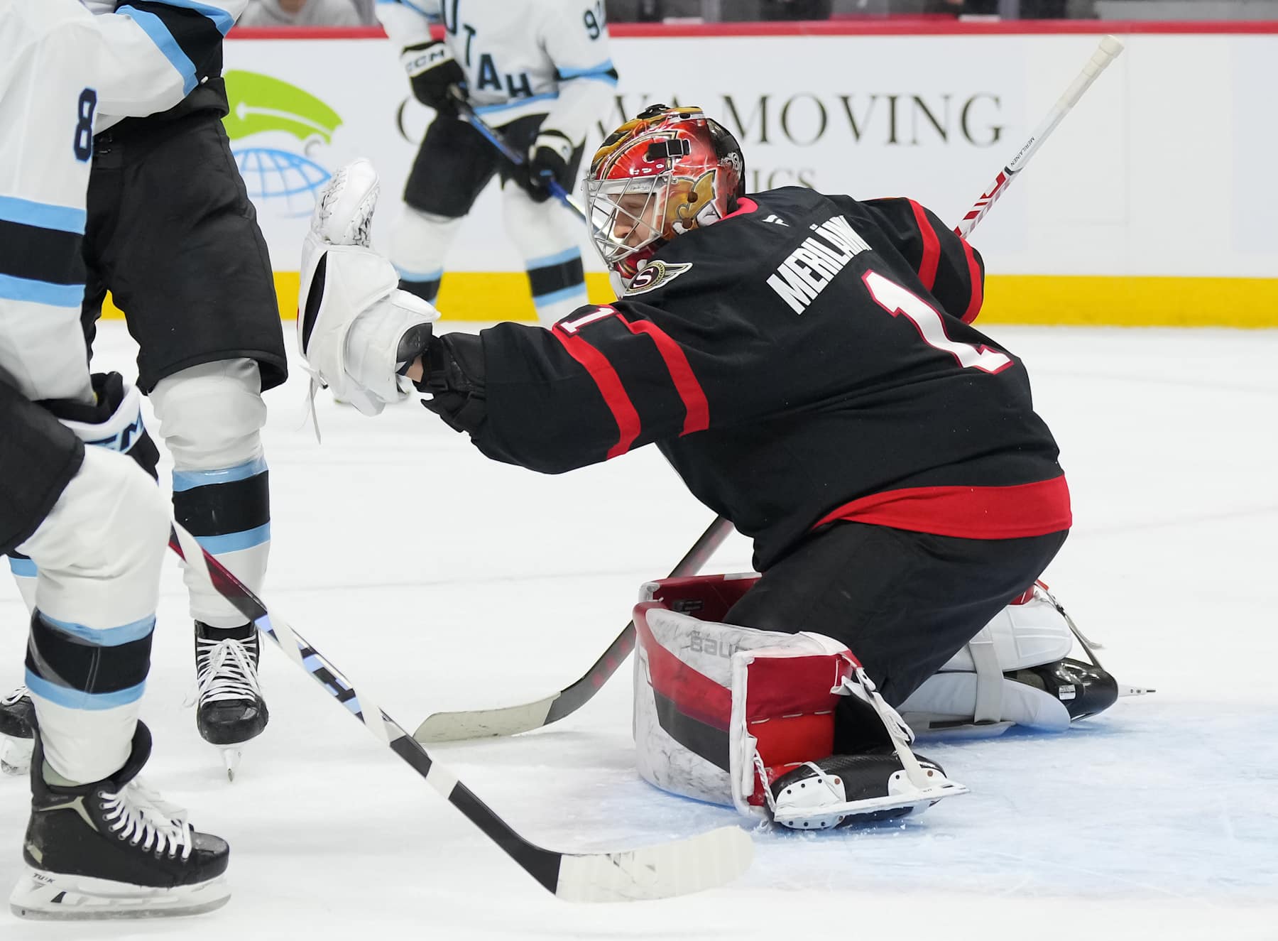 OTTAWA, CANADA - JANUARY 26: Leevi Merilainen #1 of the Ottawa Senators makes a glove save against the Utah Hockey Club in the first period at Canadian Tire Centre on January 26, 2025 in Ottawa, Ontario, Canada. (Photo by Chris Tanouye/Freestyle Photography/Getty Images)