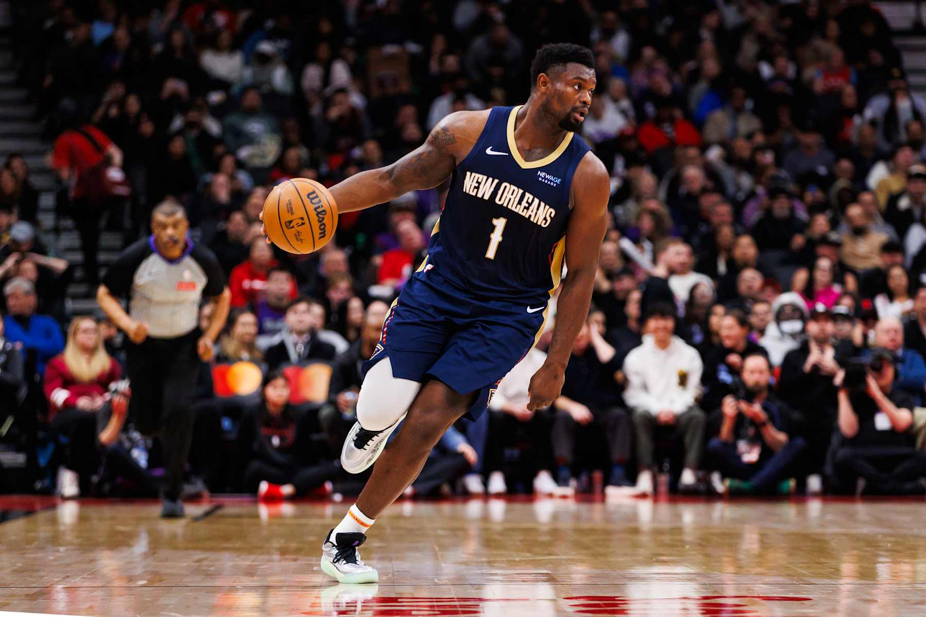 TORONTO, CANADA - JANUARY 27: Zion Williamson #1 of the New Orleans Pelicans dribbles up court against the Toronto Raptors during second half of their NBA game at Scotiabank Arena on January 27, 2025 in Toronto, Canada. NOTE TO USER: User expressly acknowledges and agrees that, by downloading and or using this photograph, User is consenting to the terms and conditions of the Getty Images License Agreement. (Photo by Cole Burston/Getty Images)