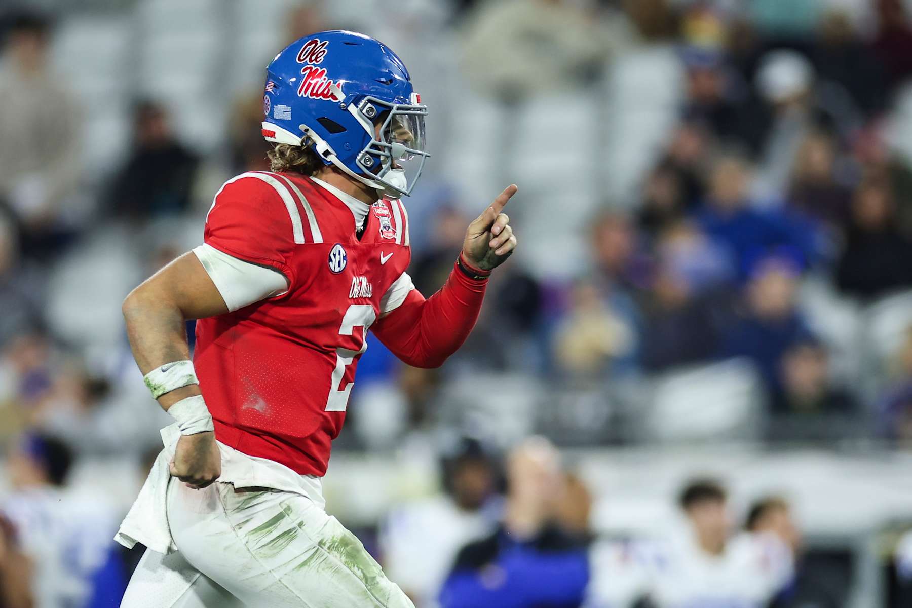 JACKSONVILLE, FLORIDA - JANUARY 02: Jaxson Dart #2 of the Mississippi Rebels celebrates after scoring a touchdown during the firs half of the TaxSlayer Gator Bowl against the Duke Blue Devils at EverBank Stadium on January 02, 2025 in Jacksonville, Florida. (Photo by James Gilbert/Getty Images)