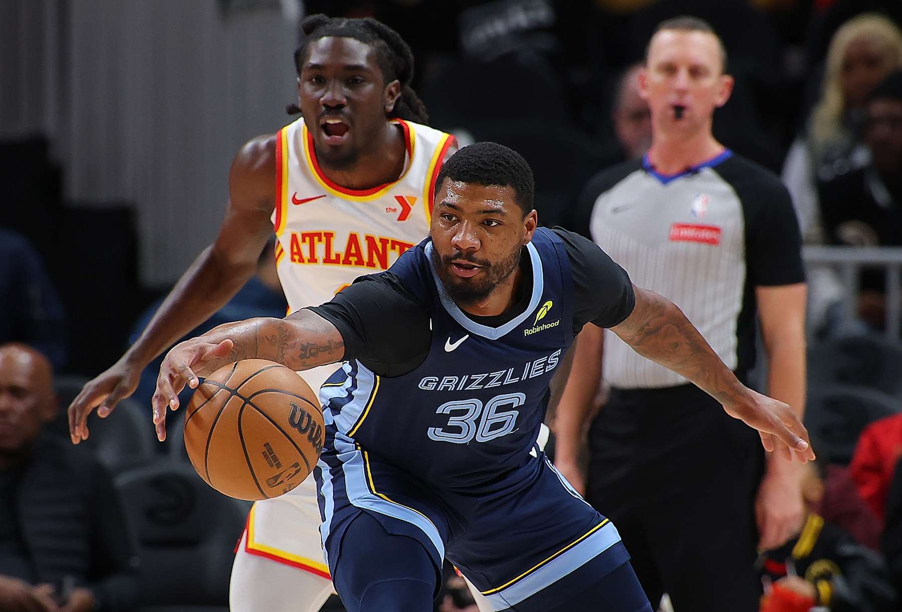 ATLANTA, GEORGIA - DECEMBER 21:  Marcus Smart #36 of the Memphis Grizzlies catches a pass against Keaton Wallace #2 of the Atlanta Hawks during the first quarter at State Farm Arena on December 21, 2024 in Atlanta, Georgia.  NOTE TO USER: User expressly acknowledges and agrees that, by downloading and/or using this photograph, user is consenting to the terms and conditions of the Getty Images License Agreement.  (Photo by Kevin C. Cox/Getty Images)