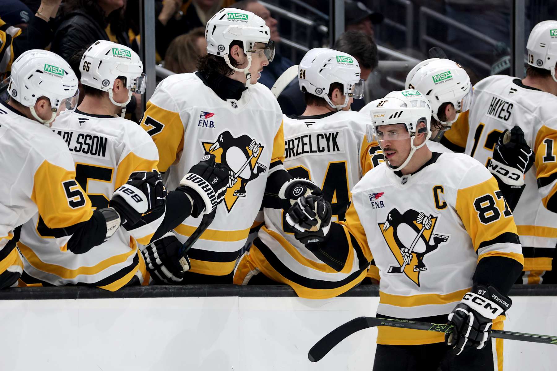 SEATTLE, WASHINGTON - JANUARY 25: Sidney Crosby #87 of the Pittsburgh Penguins celebrates his goal against the Seattle Kraken during the second period at Climate Pledge Arena on January 25, 2025 in Seattle, Washington. (Photo by Steph Chambers/Getty Images)